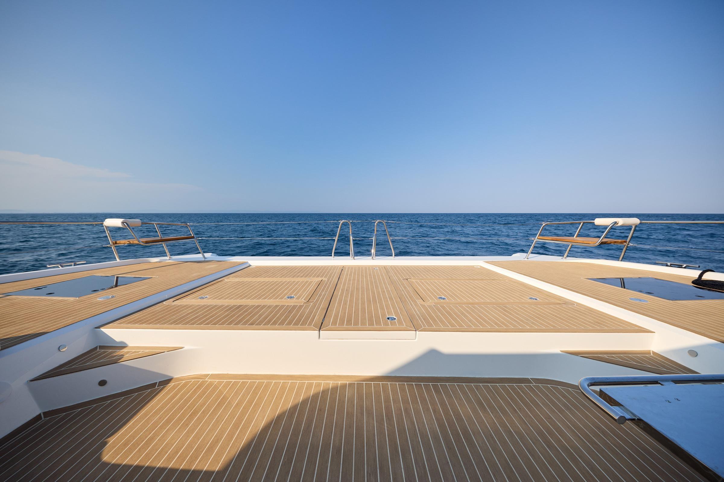 Custom Omaya 50 Power Catamaran 2025, spacious deck with ocean view.