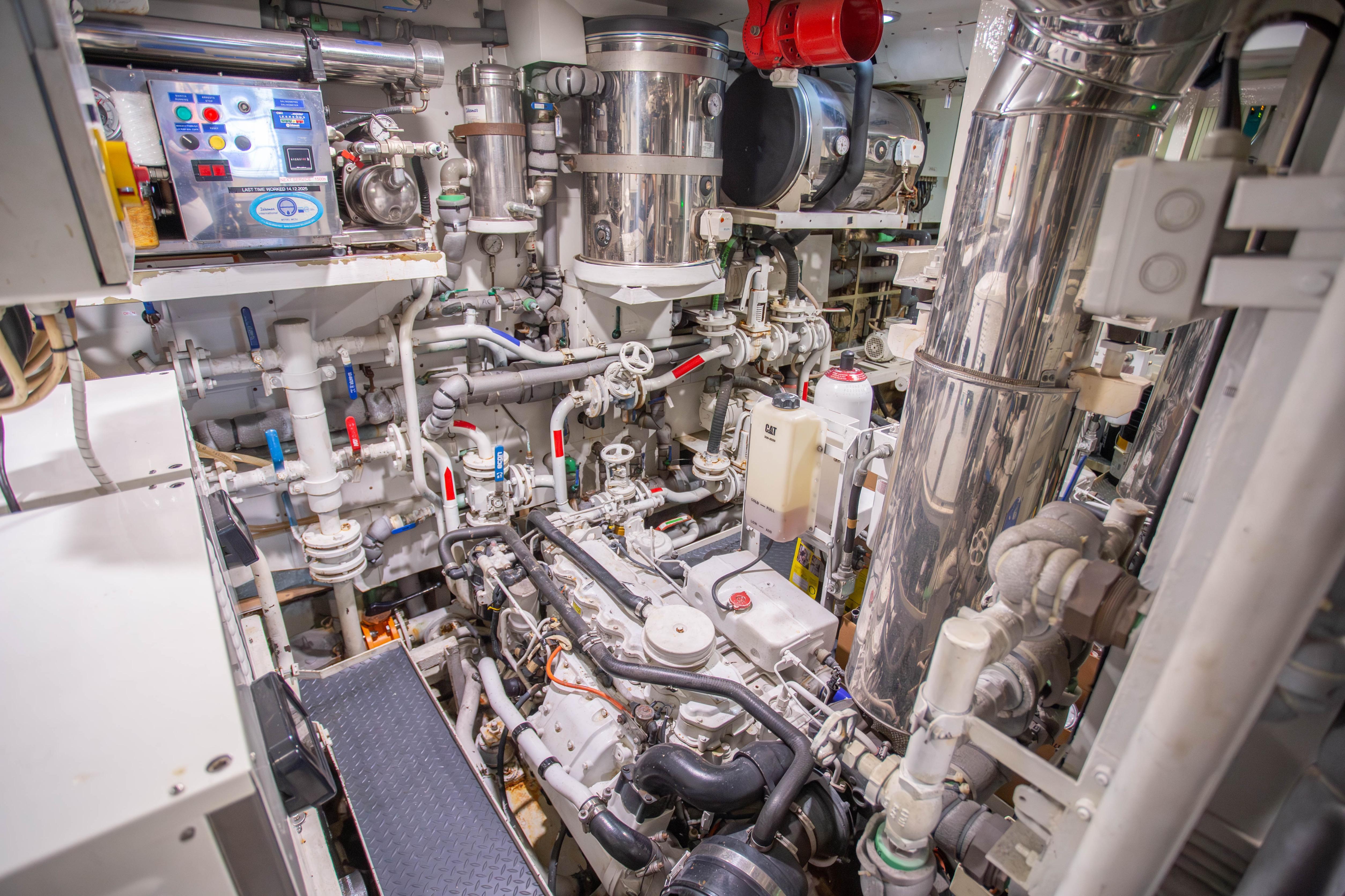 Engine room of 2014 Fifth Ocean Yachts 24m Displacement Explorer Yacht, showcasing complex machinery.