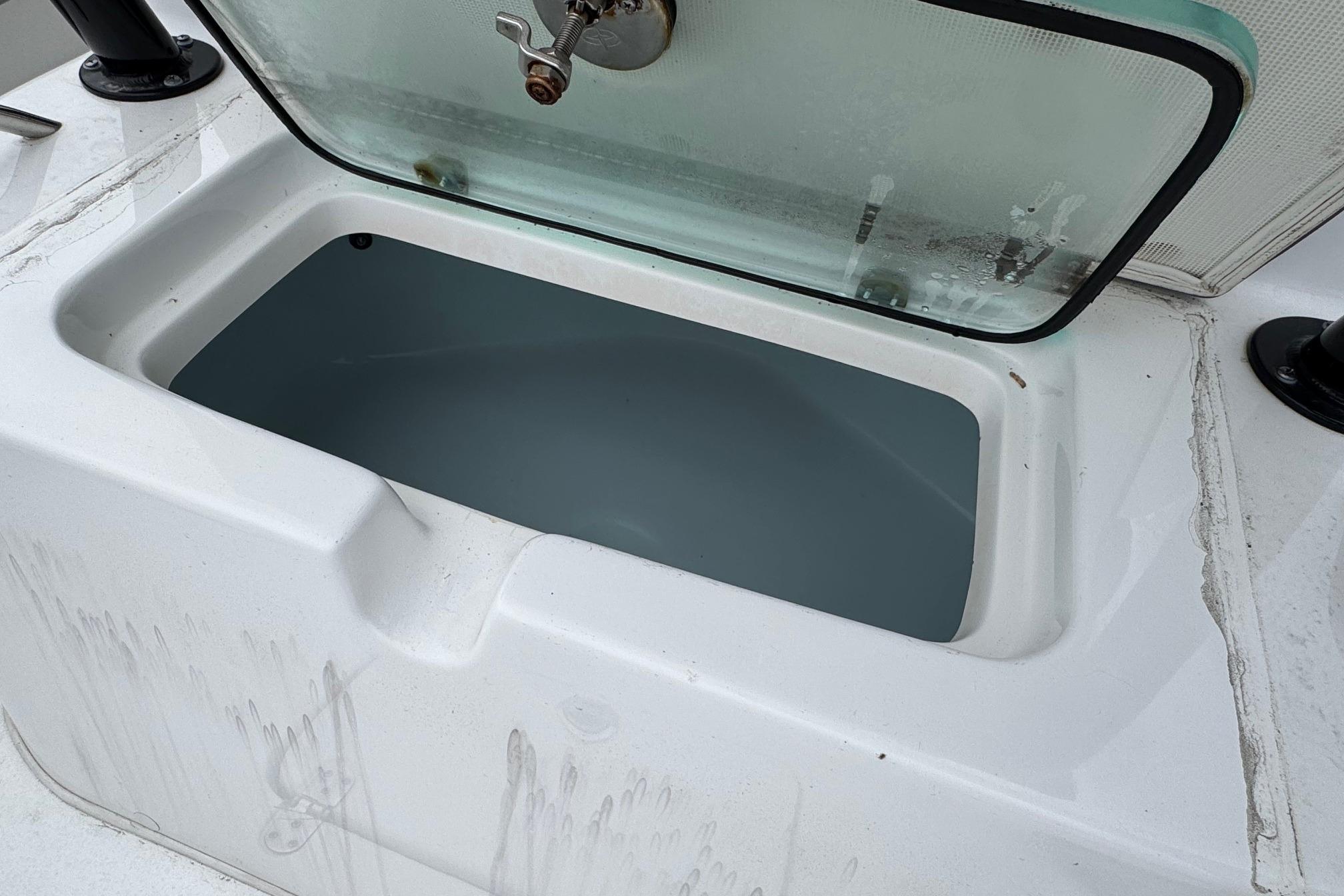 Open storage compartment on 2024 Cape Horn 32 XS boat.