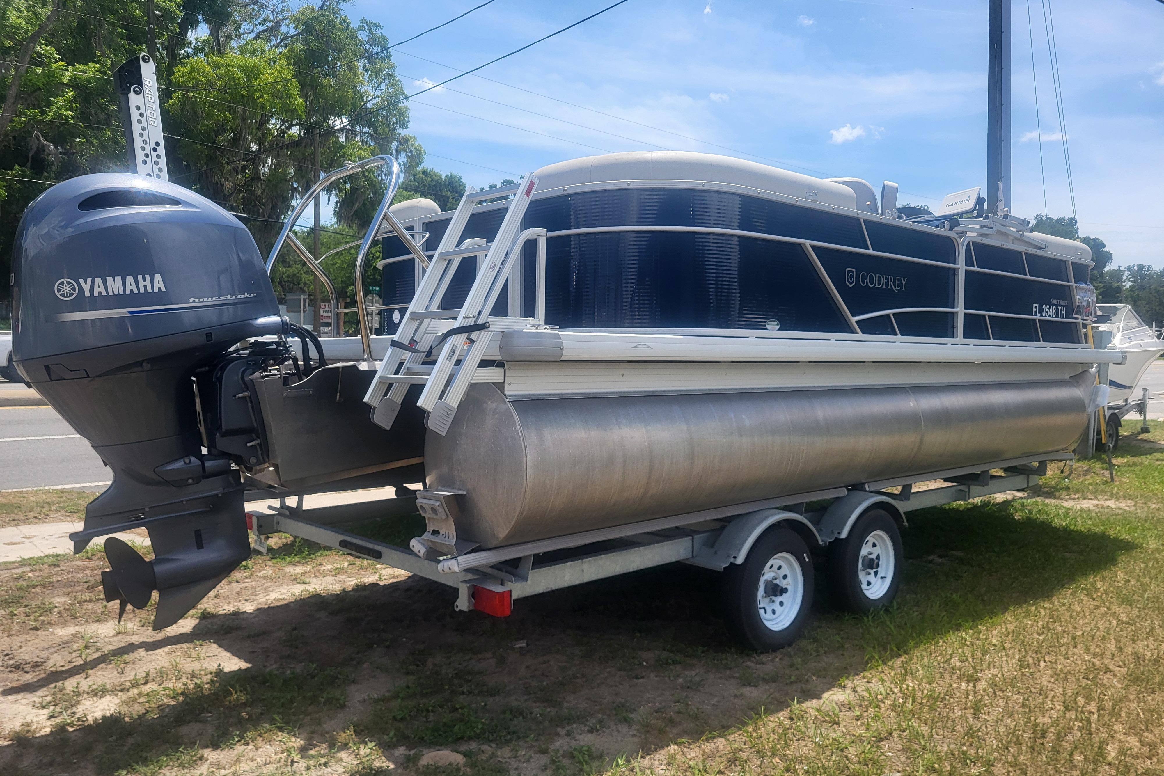 2022 Godfrey Sweetwater 2286 C pontoon boat with Yamaha motor on trailer.