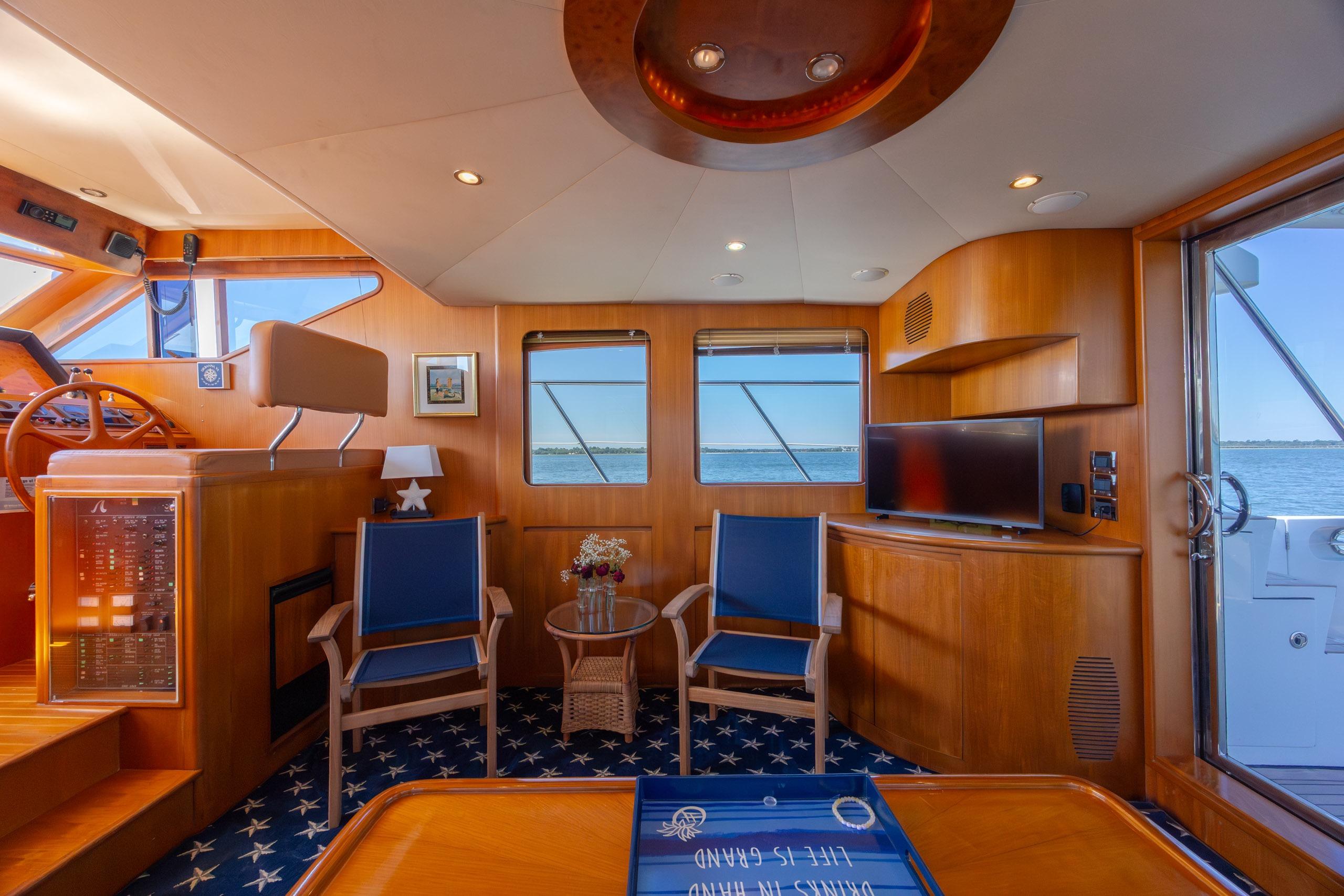 Luxurious interior of 2005 Ocean Alexander 52 Sedan yacht with elegant wood finishes.