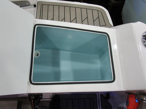 Open storage compartment on 2025 Cutwater C-248 Coupe boat.