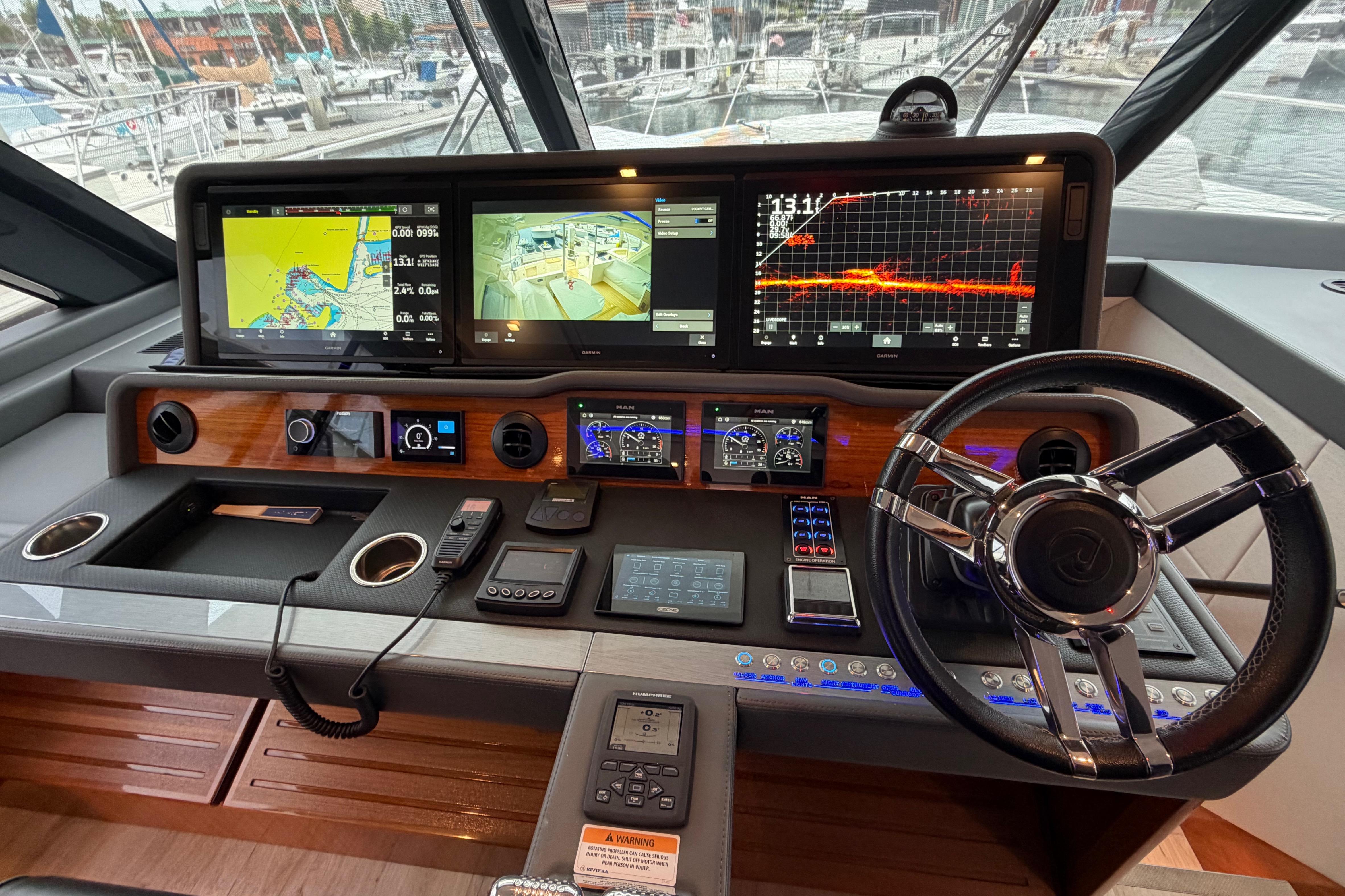Cockpit of 2023 Riviera 645 SUV with advanced navigation displays and controls.