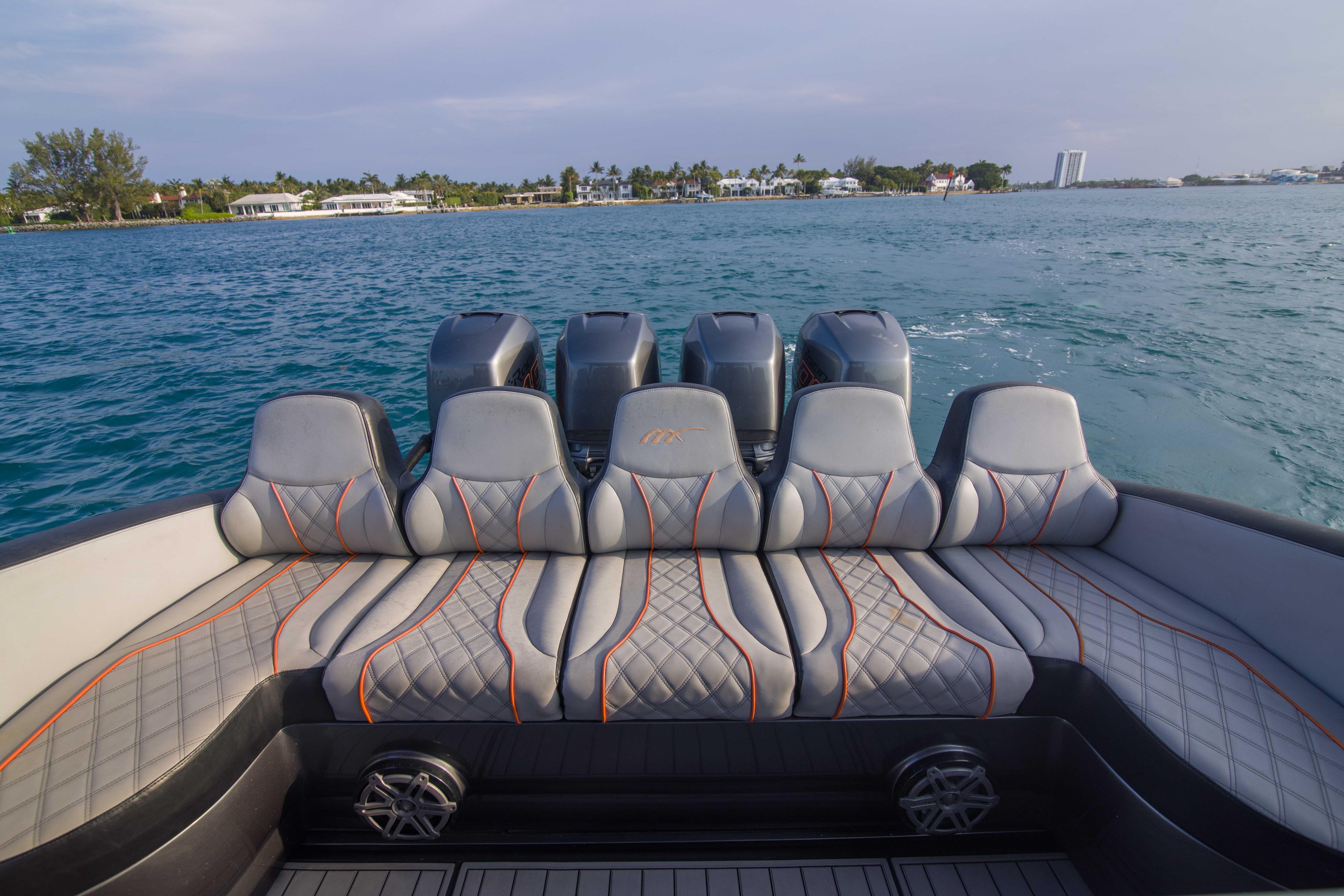 Luxury seating on a 2019 Midnight Express 43 Open boat, with scenic ocean view.
