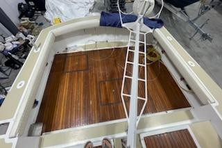 1964 Striker Model 120 boat interior with wooden deck and steering wheel.