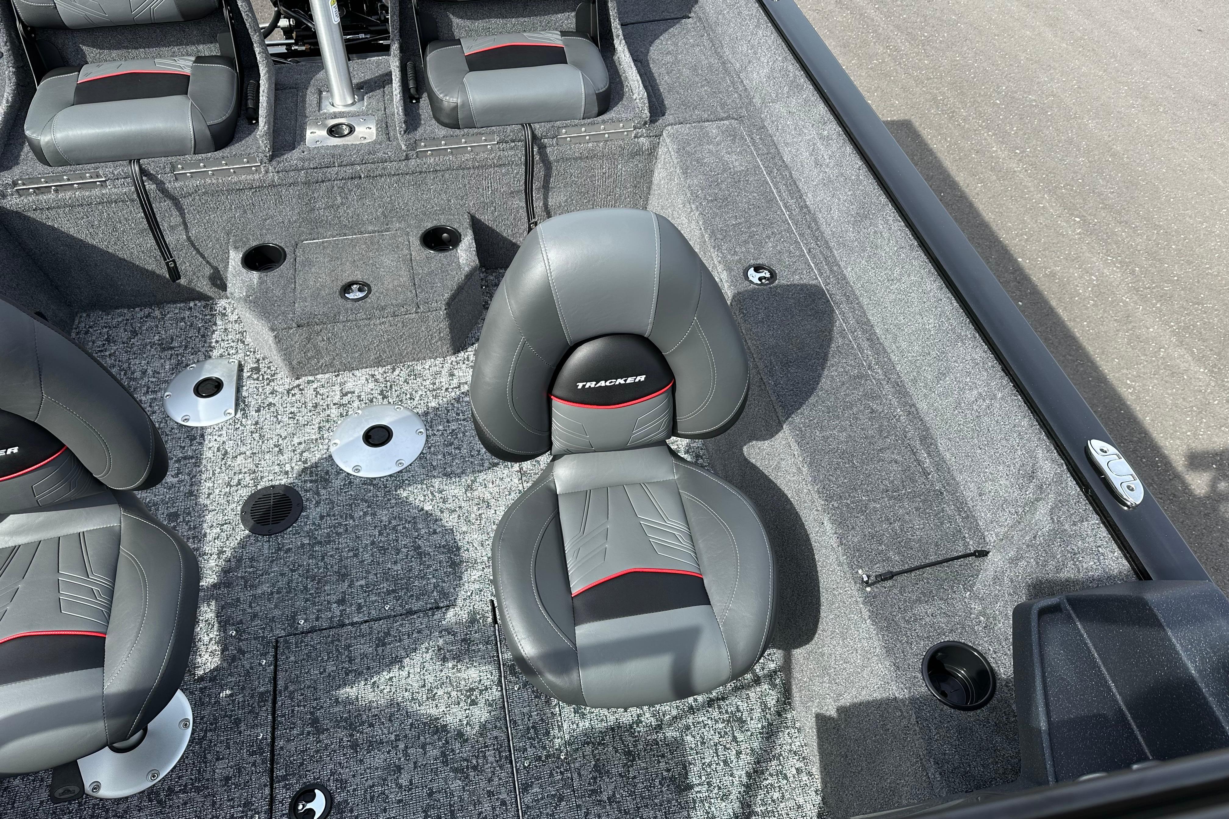 2026 Tracker Pro Guide V-175 Combo boat interior with gray seating and carpeted flooring.