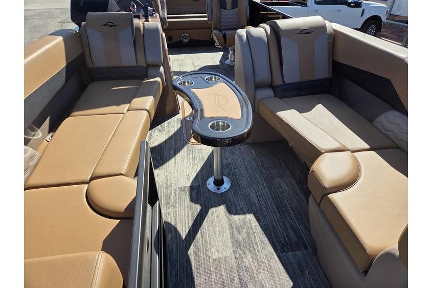 Luxurious interior of 2026 SunCatcher Diamond Elite 326 SL pontoon boat with plush seating.