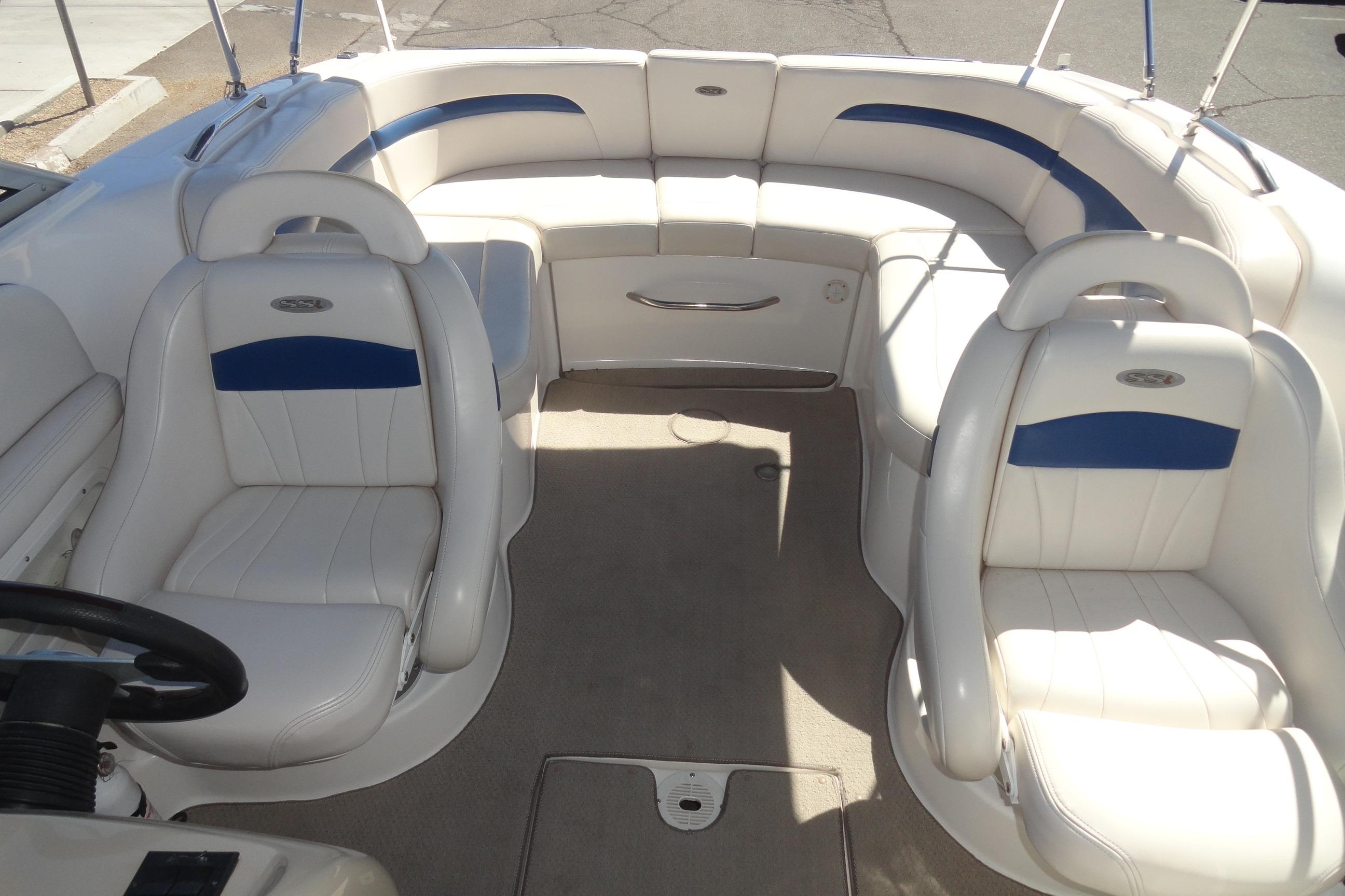2001 Chaparral 265 SSi boat interior with white and blue seating arrangement.