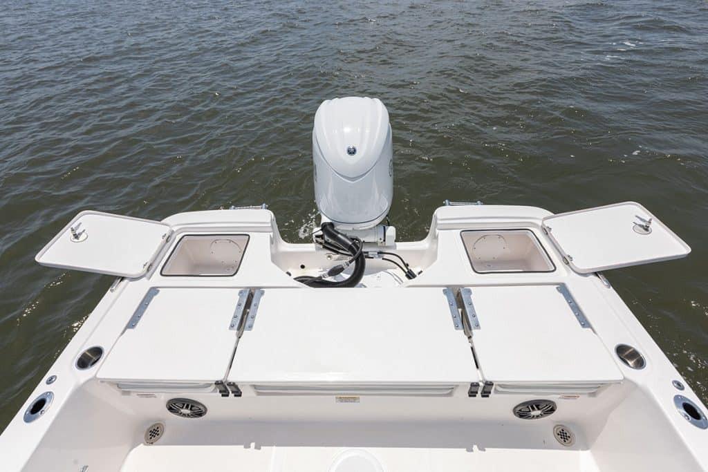 2027 Sea Fox 231 Bay Fox boat stern view with open storage compartments.