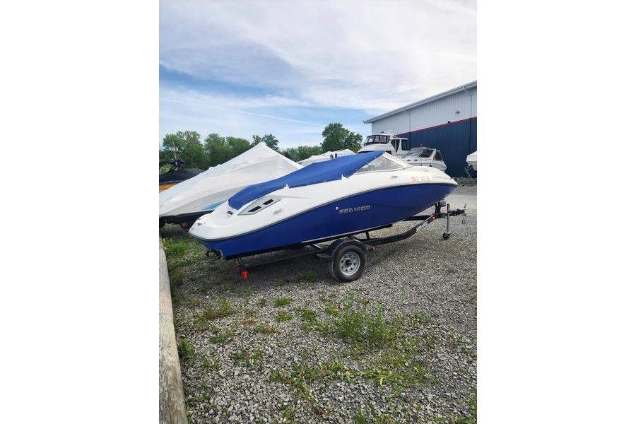 2012 Sea-Doo Sport Boats 180 Challenger on trailer, parked outdoors.