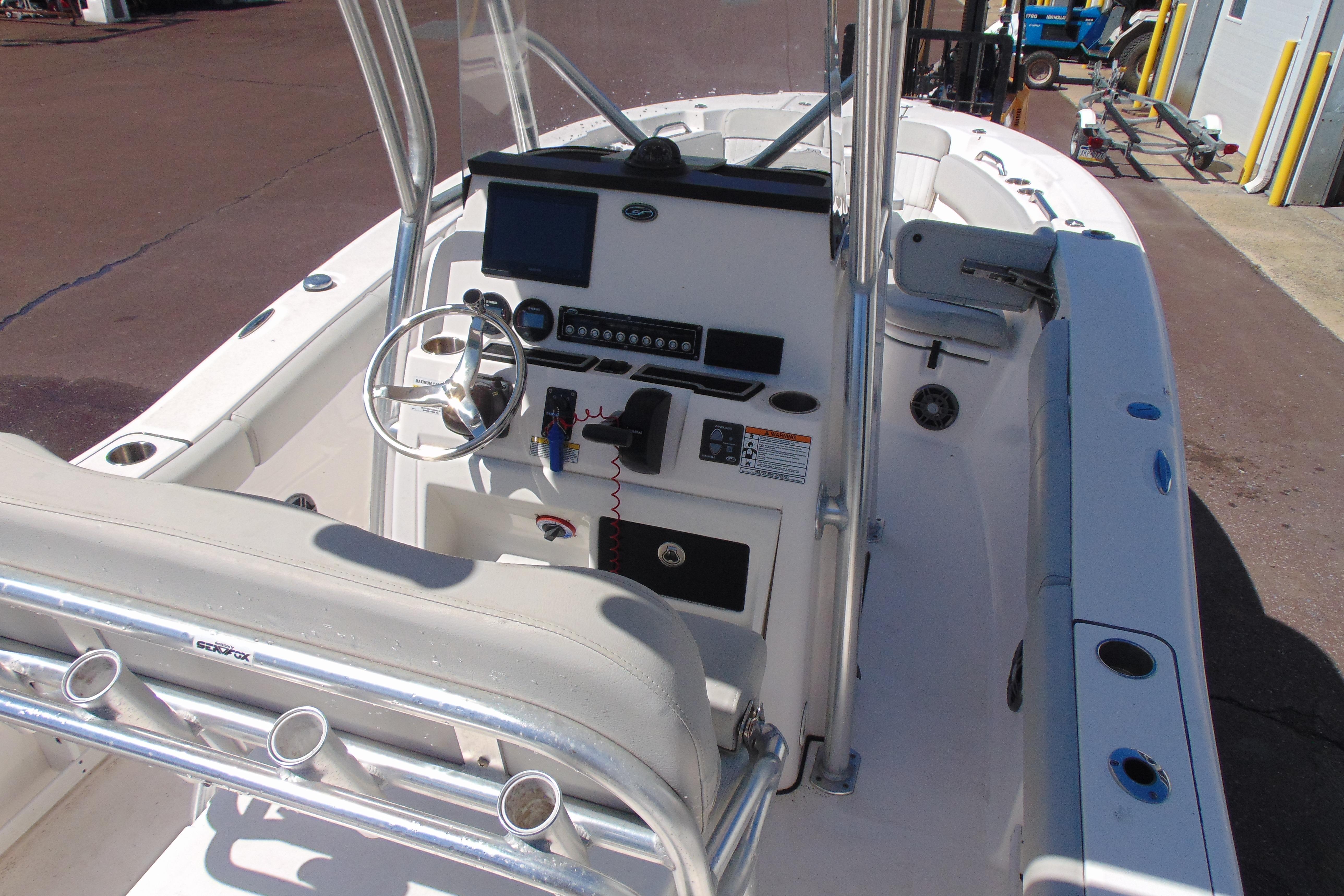 2022 Sea Fox 248 Commander boat interior with steering console and seating.