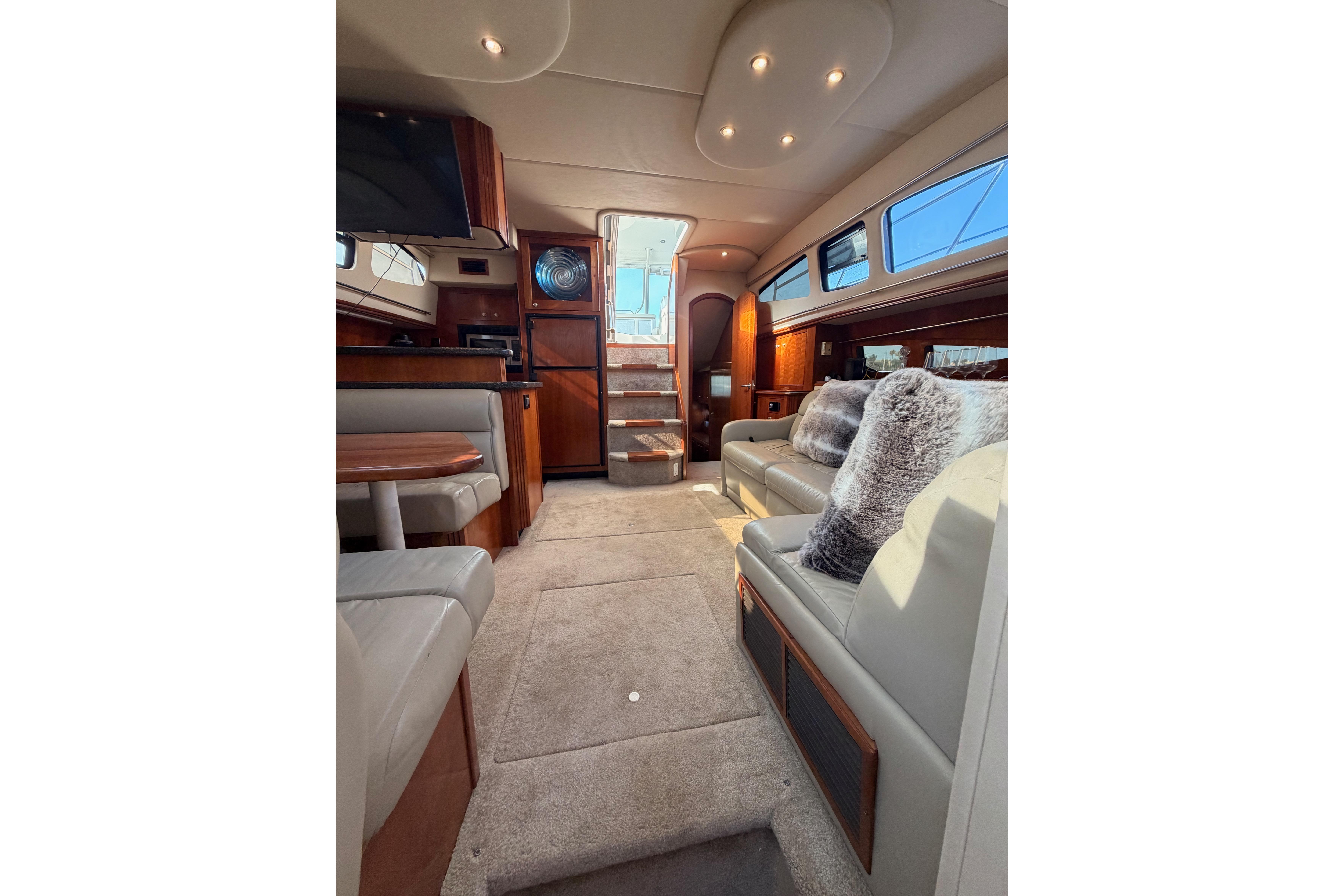 Luxurious interior of 2005 Cruisers Yachts 405 Express Motoryacht with plush seating and elegant design.