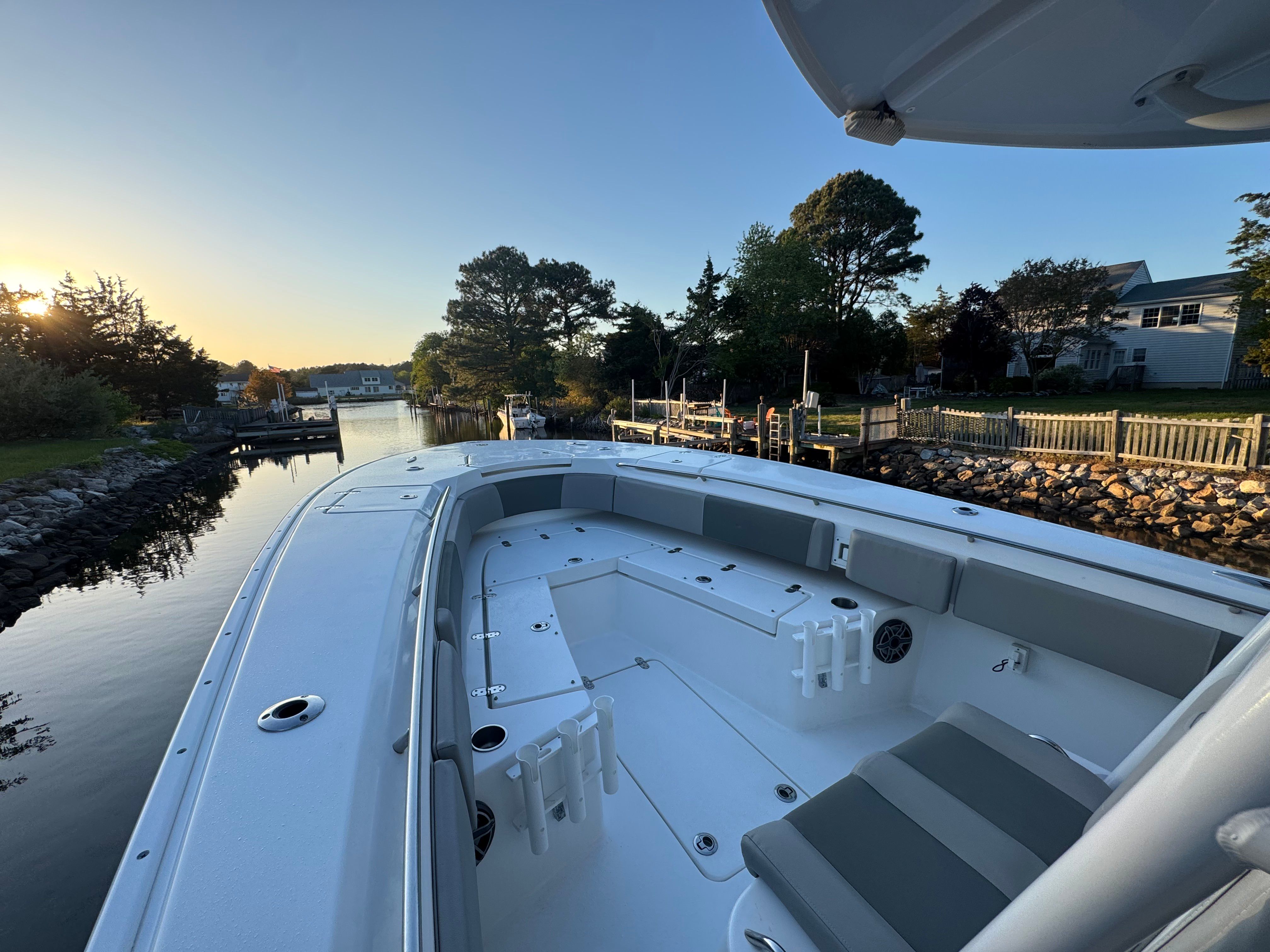 2021 Cape Horn 32 XS boat at sunset by the riverside.