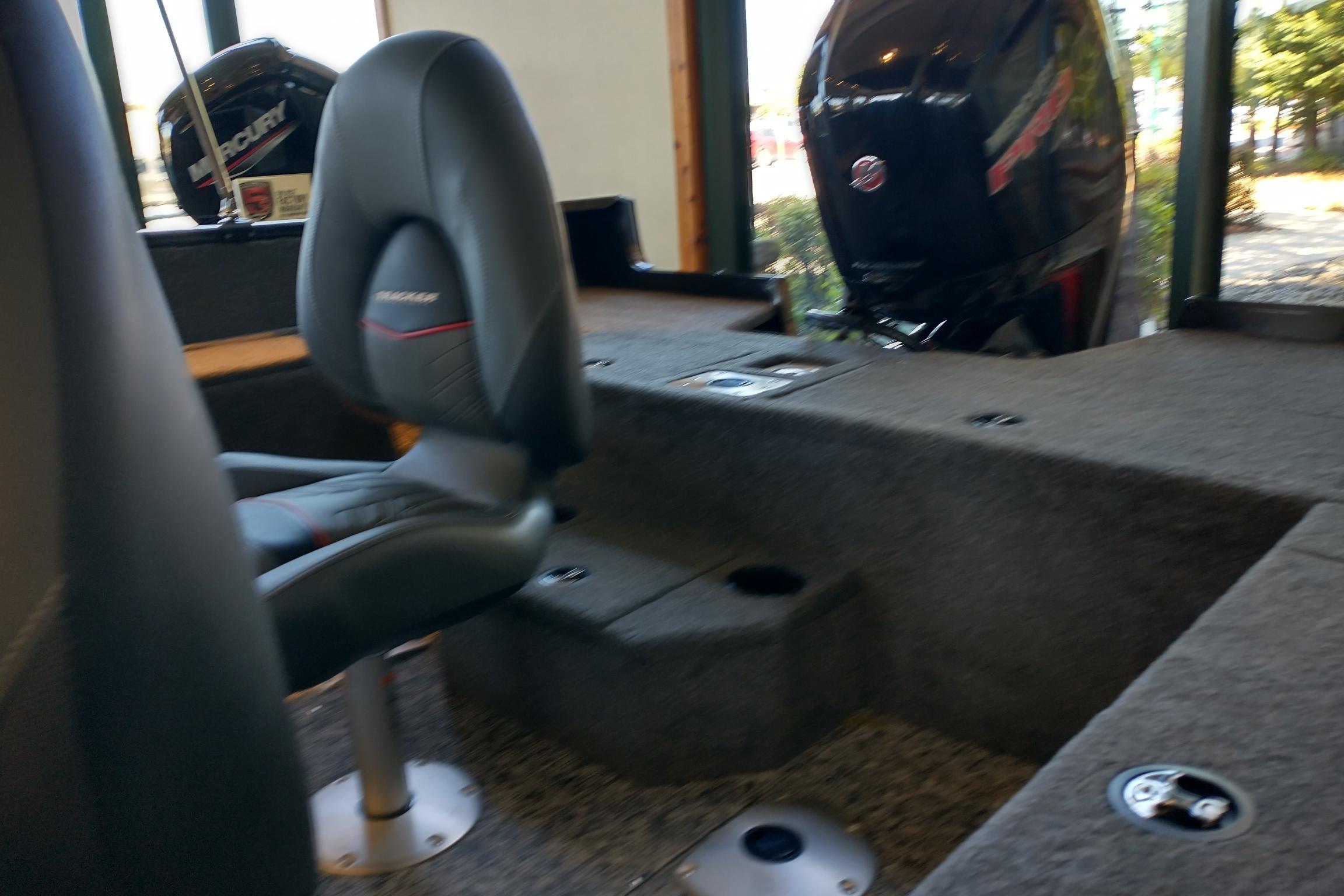 Interior of 2026 Tracker Pro Guide V-175 WT boat with seating and Mercury outboard motor.