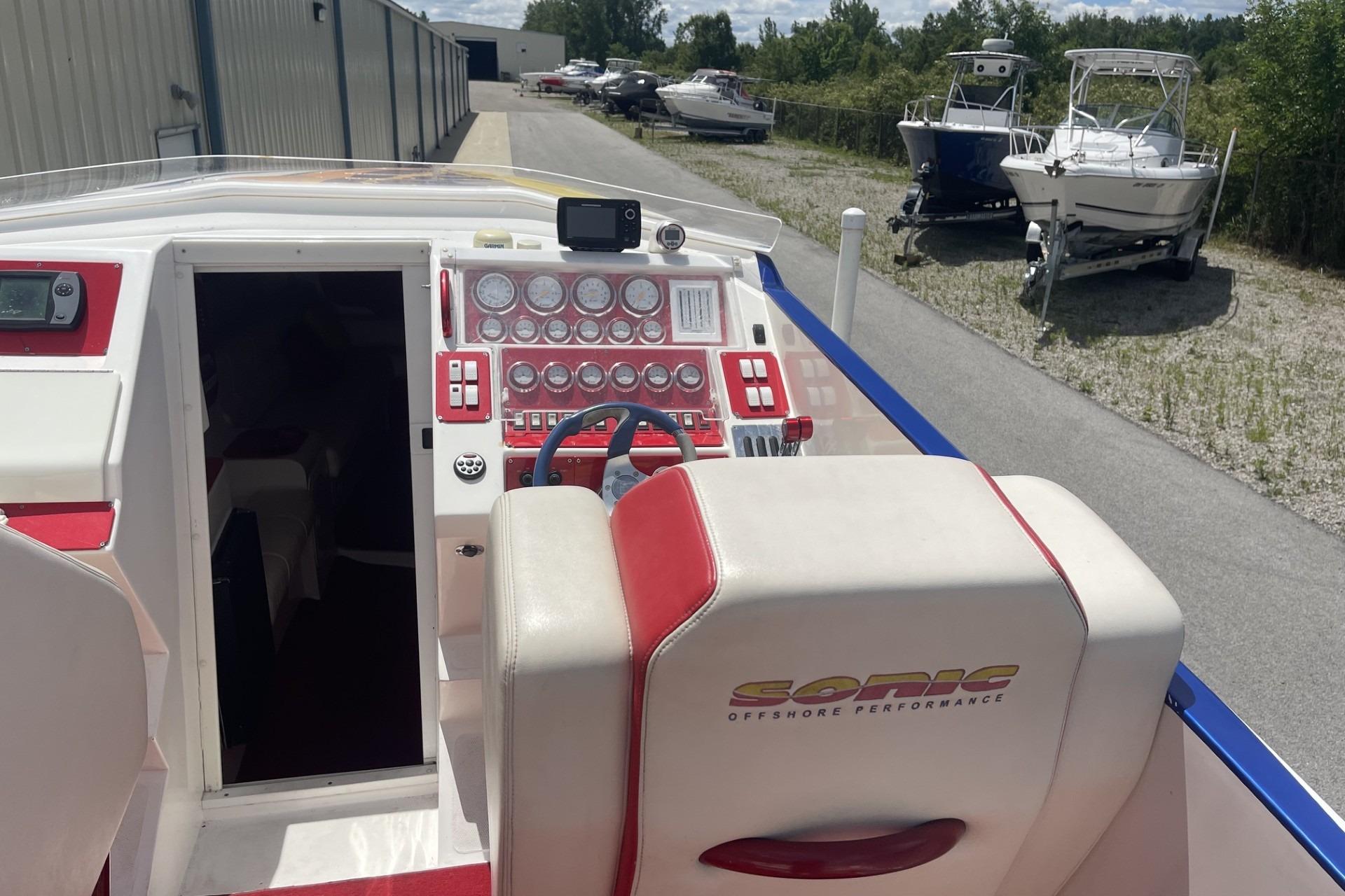 Cockpit of a 2006 Sonic 386 boat with detailed control panel and seating.