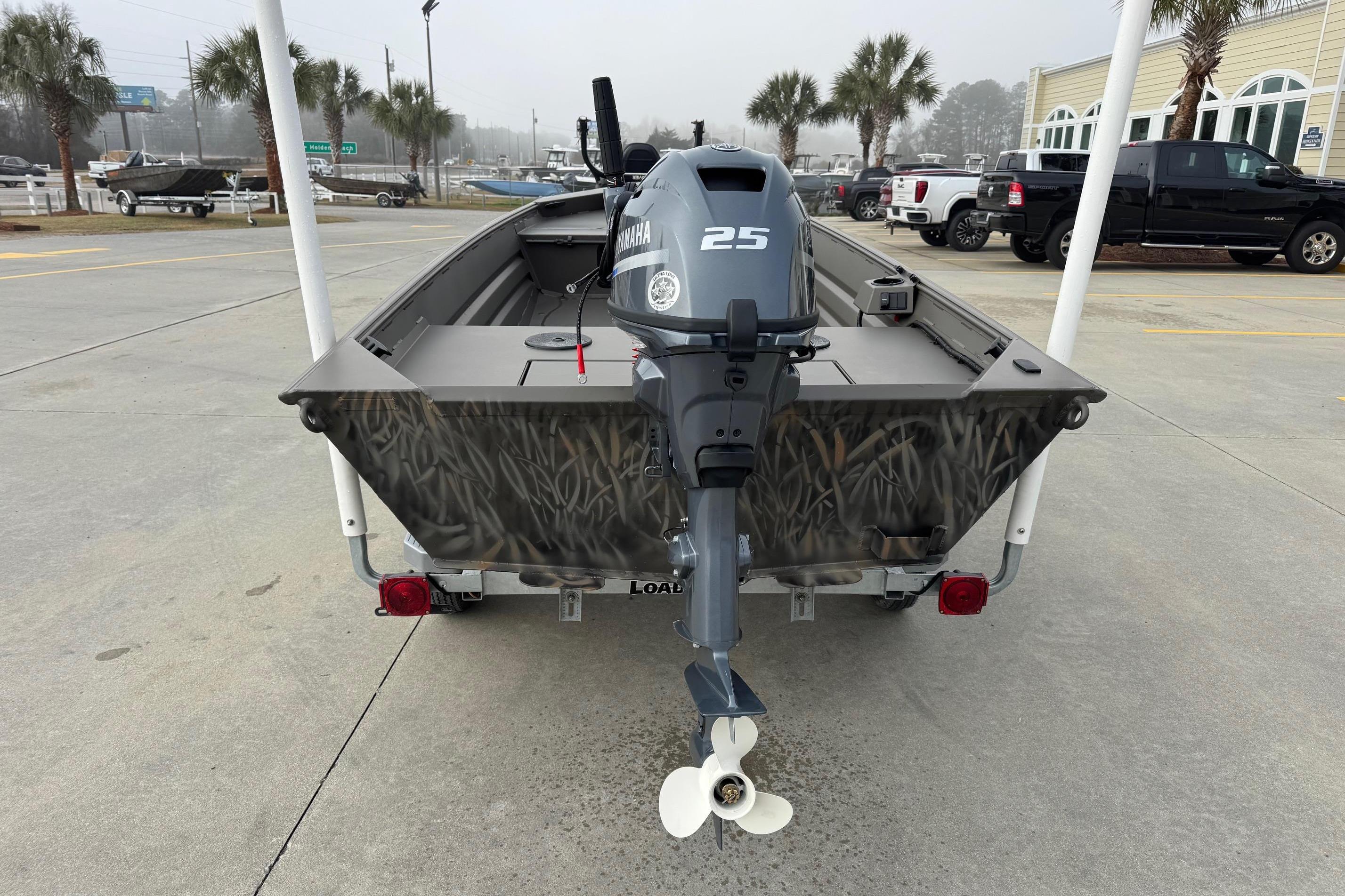 2026 Alweld 1548VV Marsh boat with Yamaha 25 outboard motor, parked outdoors.