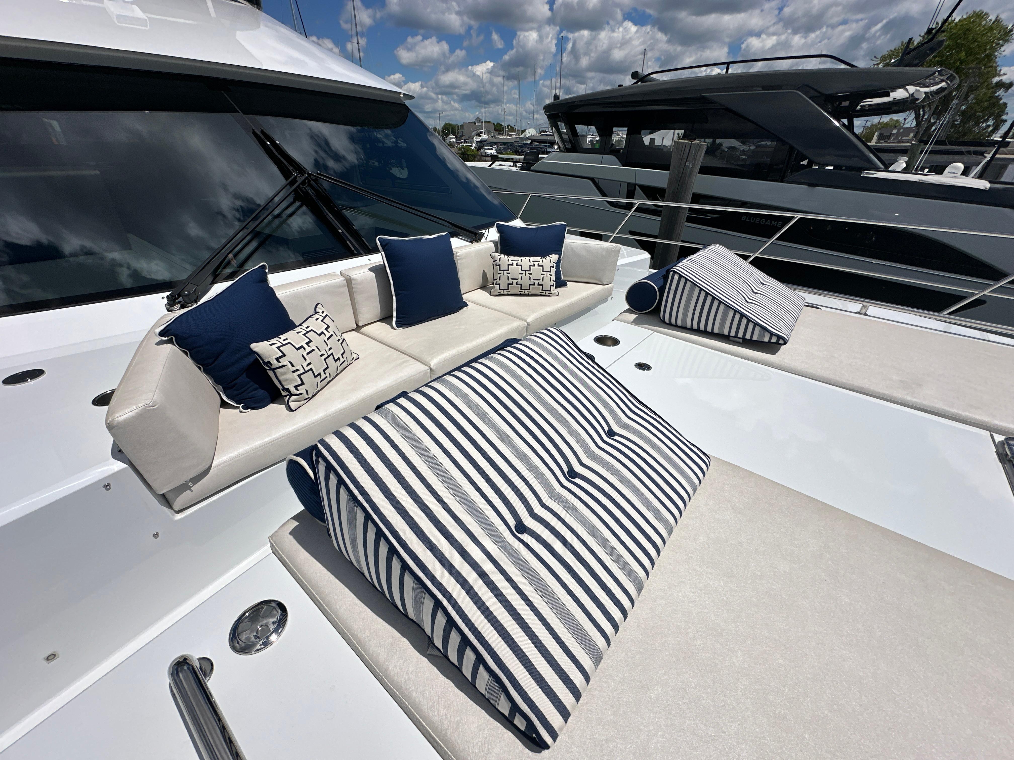 2023 CL Yachts CLB65 luxury yacht with stylish outdoor seating and striped cushions.