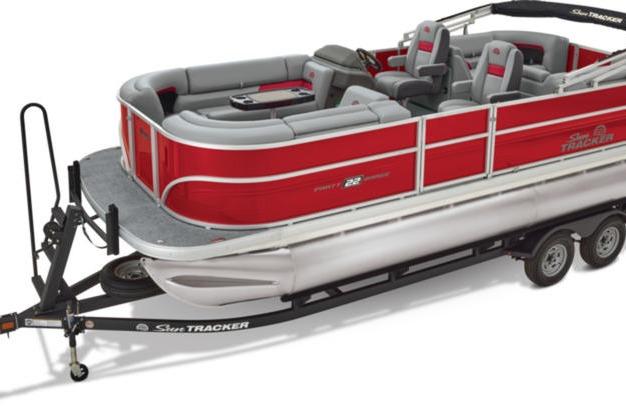 2026 Sun Tracker Party Barge 22 DLX pontoon boat on trailer, red and gray design.