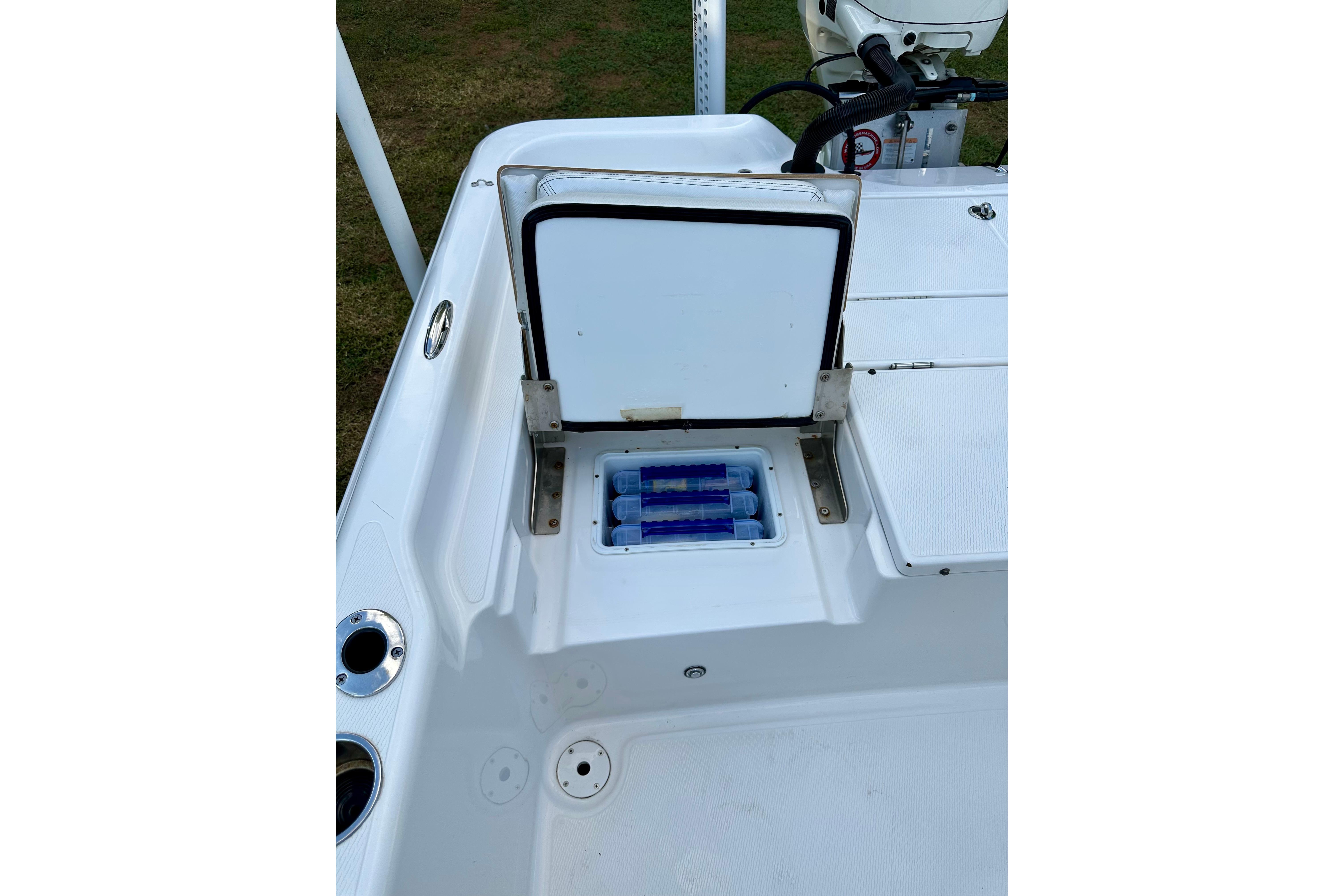 2017 Blue Wave 2400 PureBay boat with open storage compartment on deck.