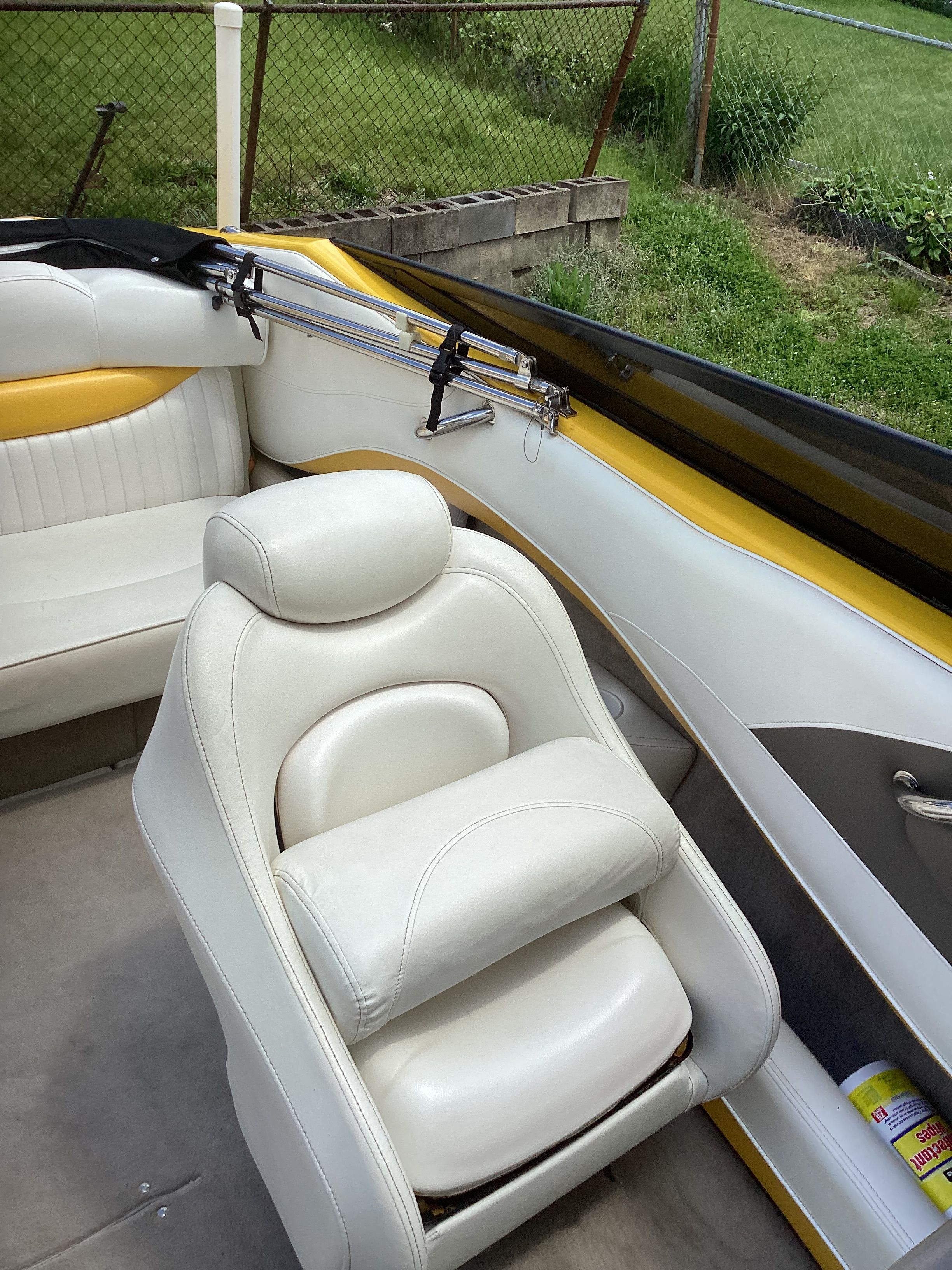 Interior of a 2005 Crownline 202 BR LPX boat with white leather seats.