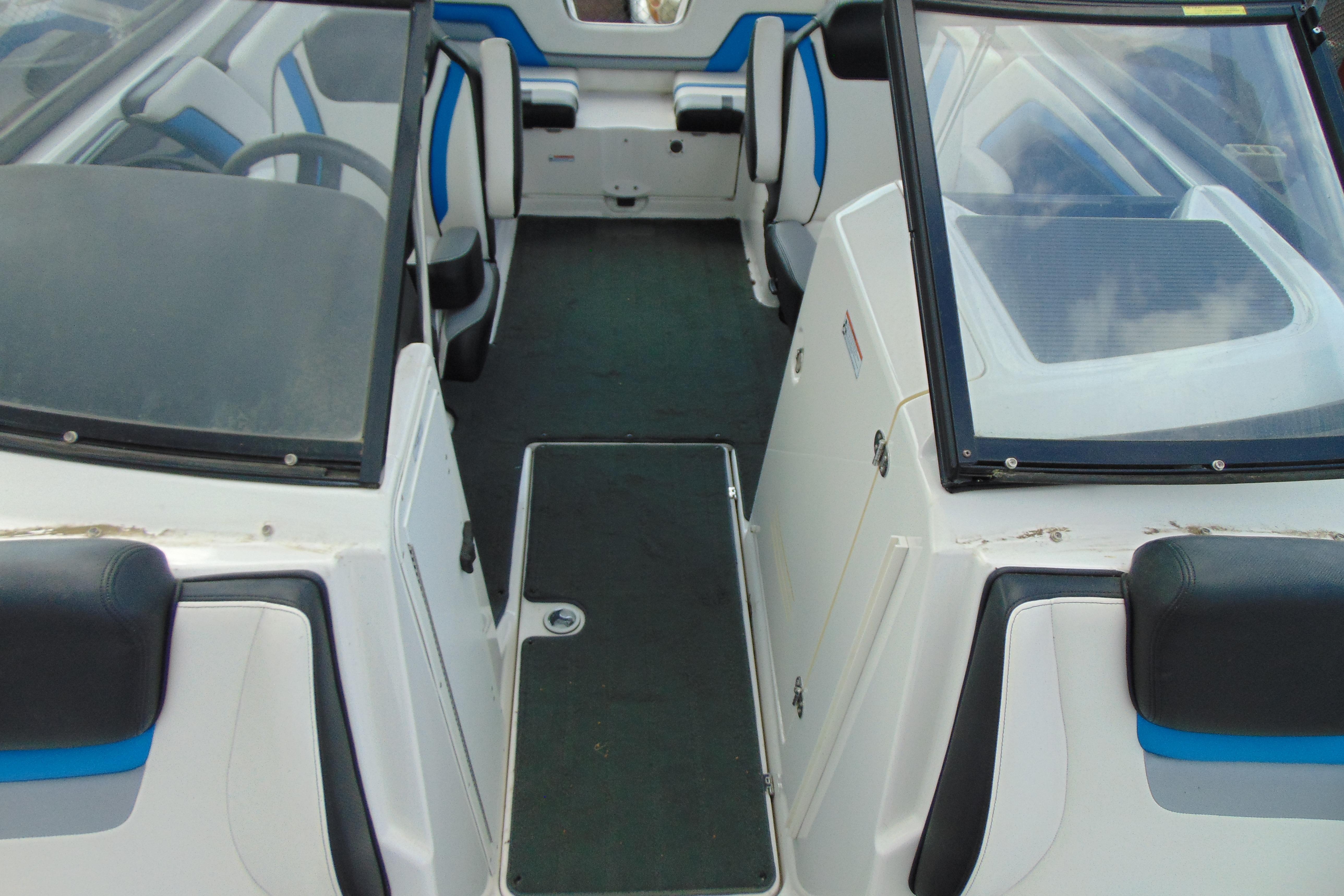 2016 Yamaha Boats 242X E-Series interior with seating and windshield view.