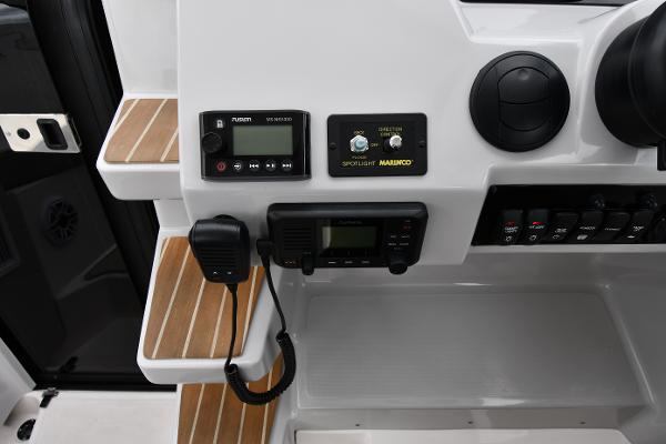 Control panel of 2021 Regal 35 Sport Coupe with radio and spotlight controls.