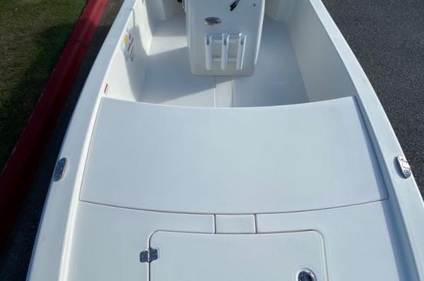 2024 Mako Pro Skiff 13 CC boat interior, white deck and storage compartments.