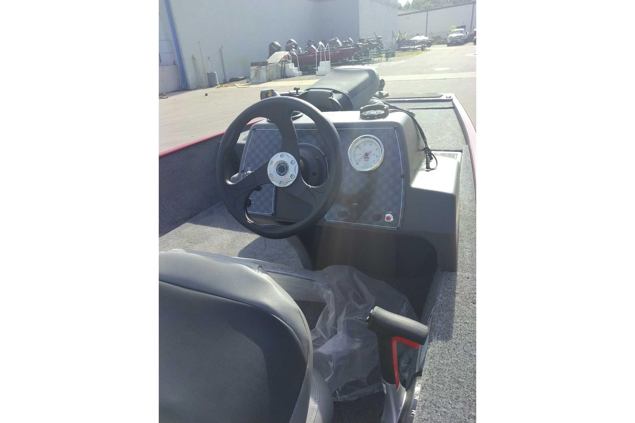 2026 Tracker Bass Tracker Classic XL boat interior with steering wheel and dashboard controls.