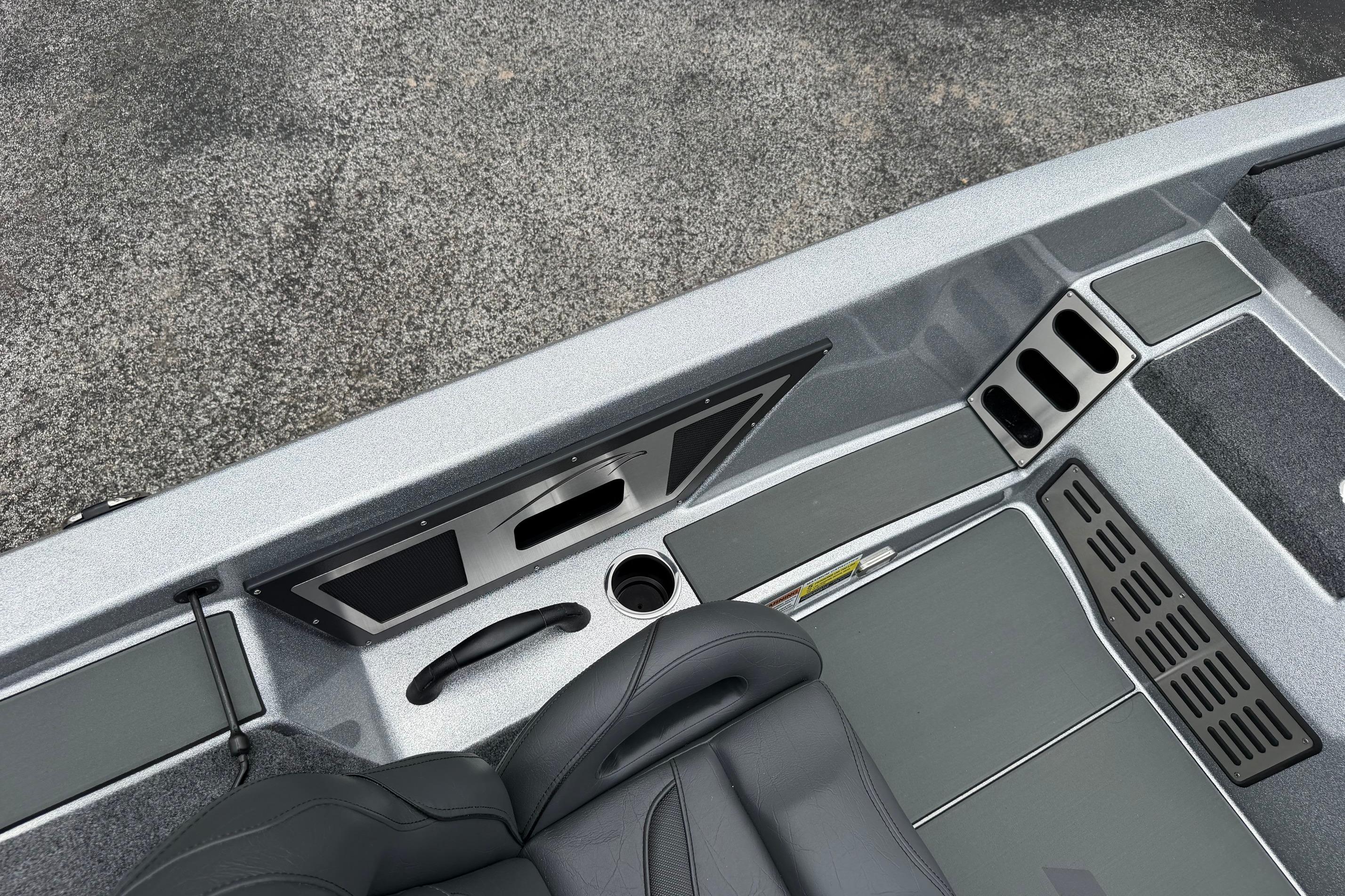 Interior view of a 2027 Falcon F20 PREDATOR boat, featuring sleek seating and storage compartments.