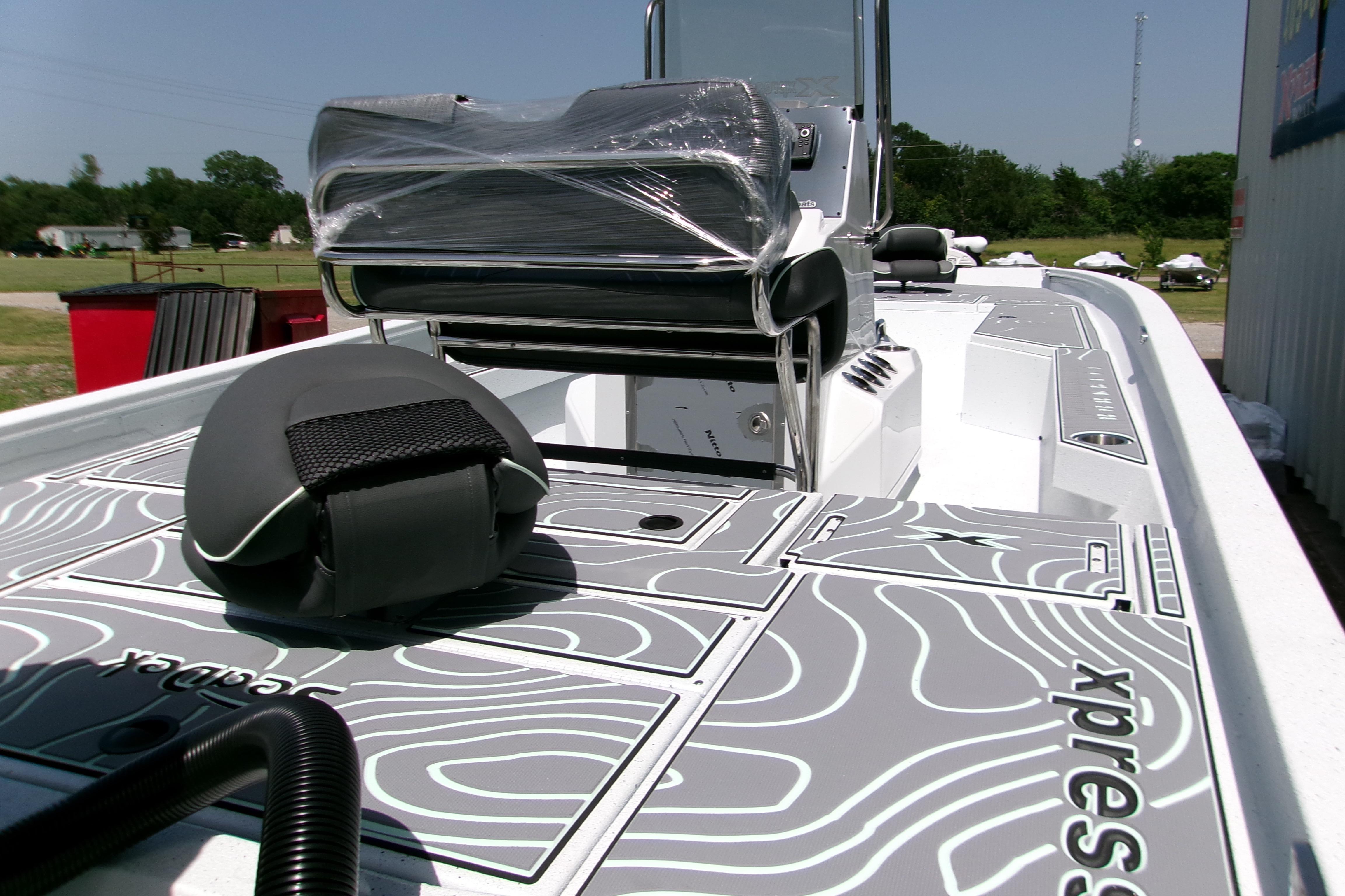 2027 Xpress H22B Bay boat with sleek deck design and modern seating.