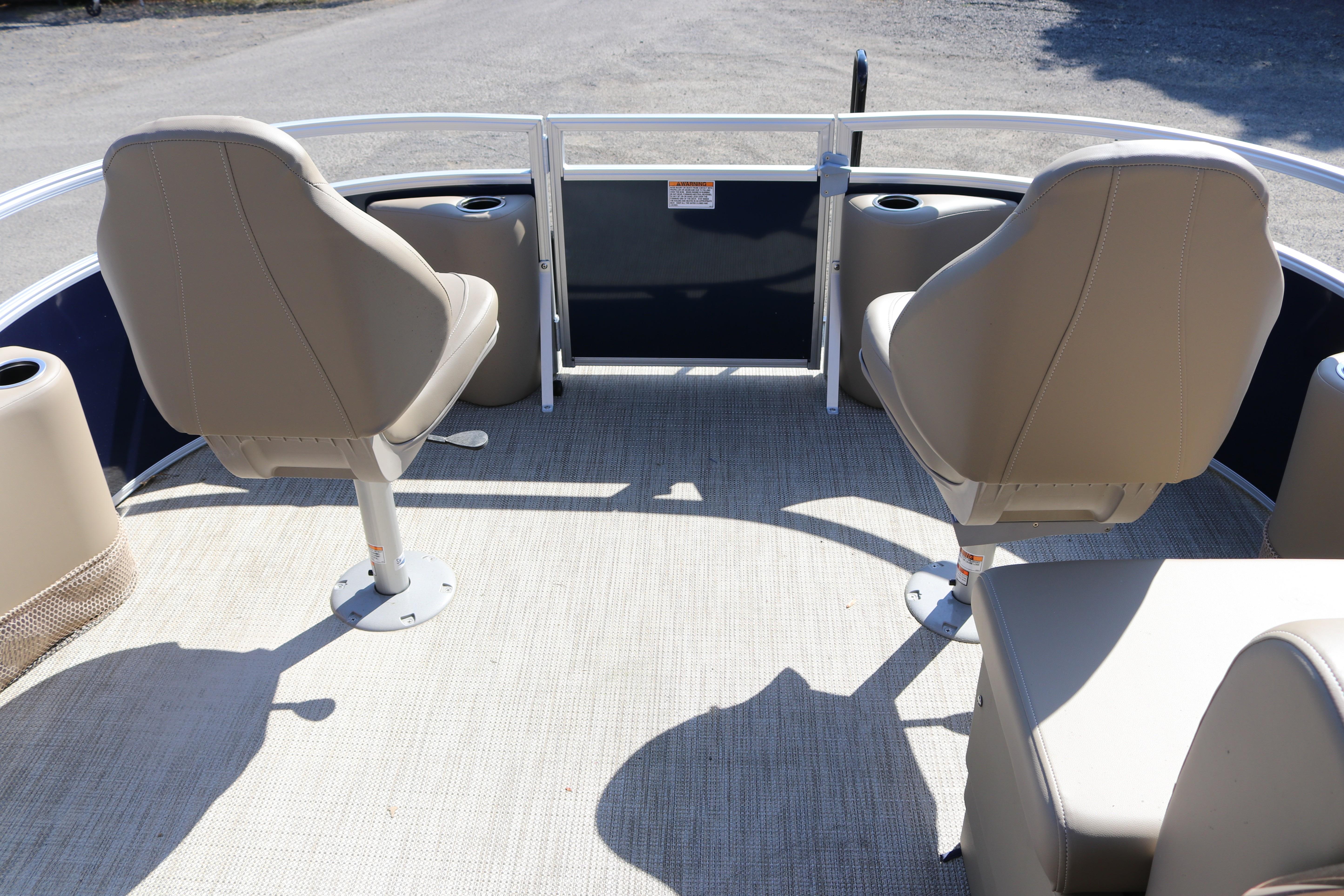 2025 Sun Chaser Vista Fish 18 boat interior with beige seating and cup holders.