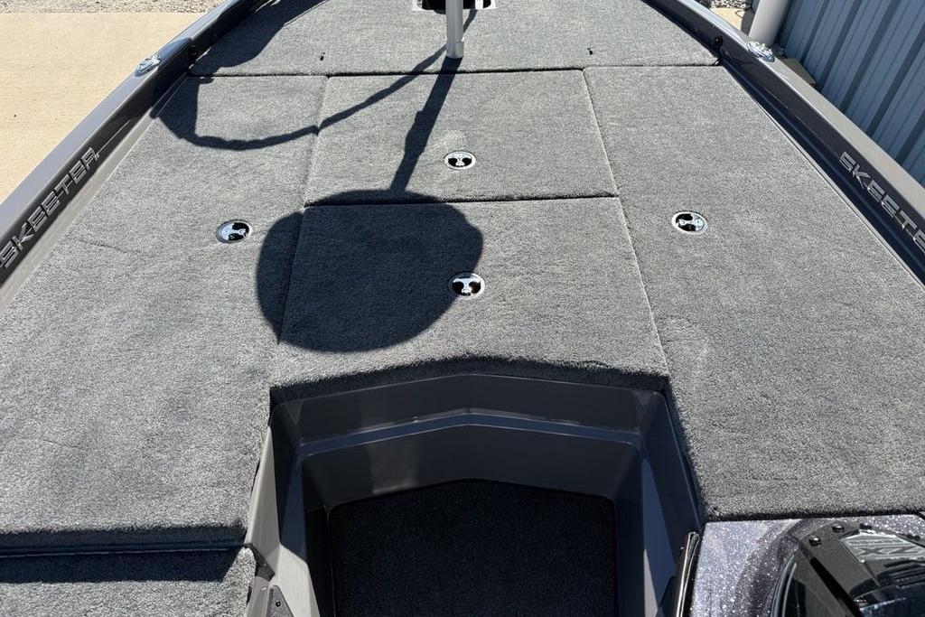 2026 Skeeter ZX150 boat deck with gray carpet and storage compartments.