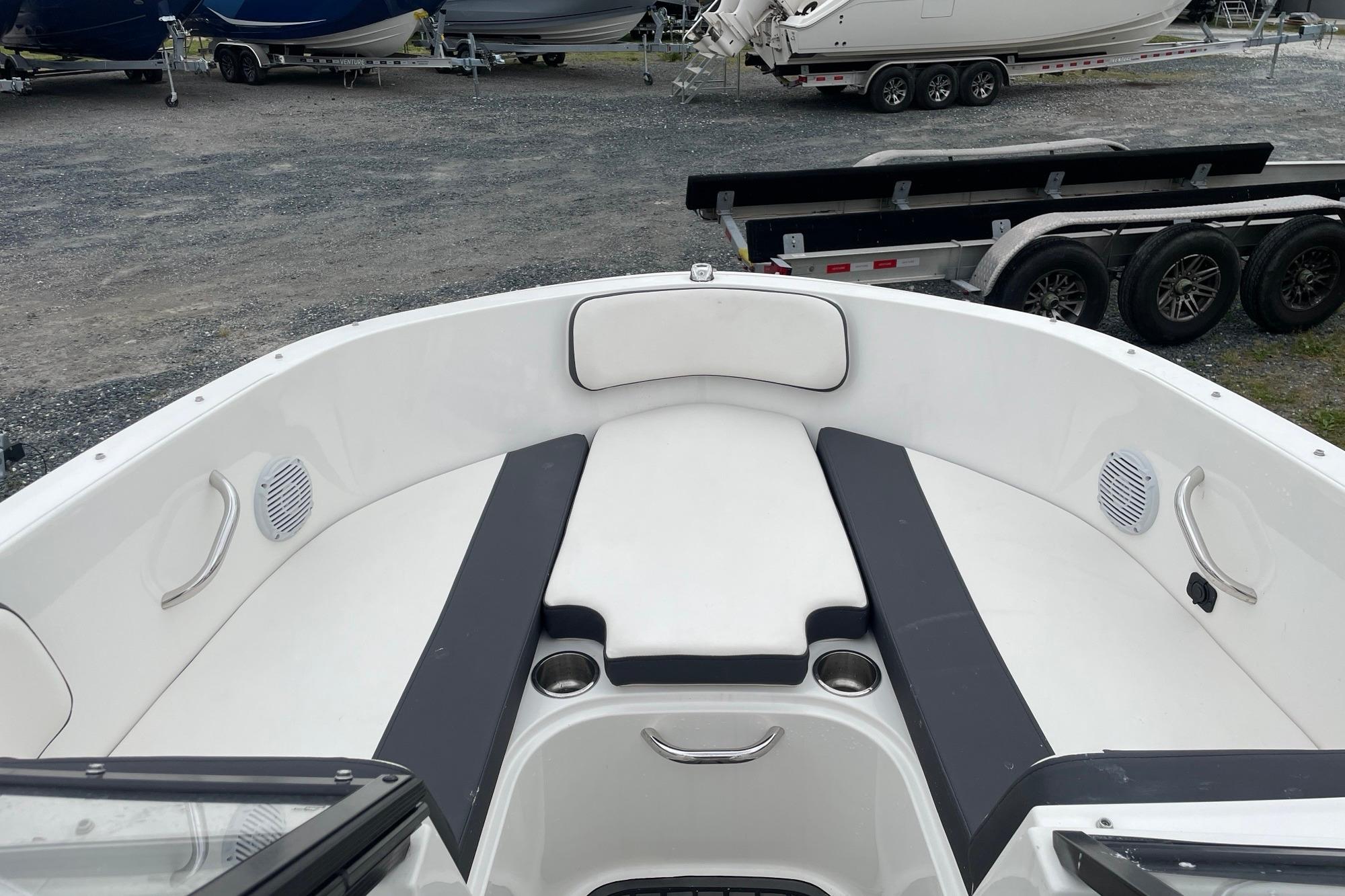 2023 Bayliner VR4 Bowrider OB interior with cushioned seating and cup holders.