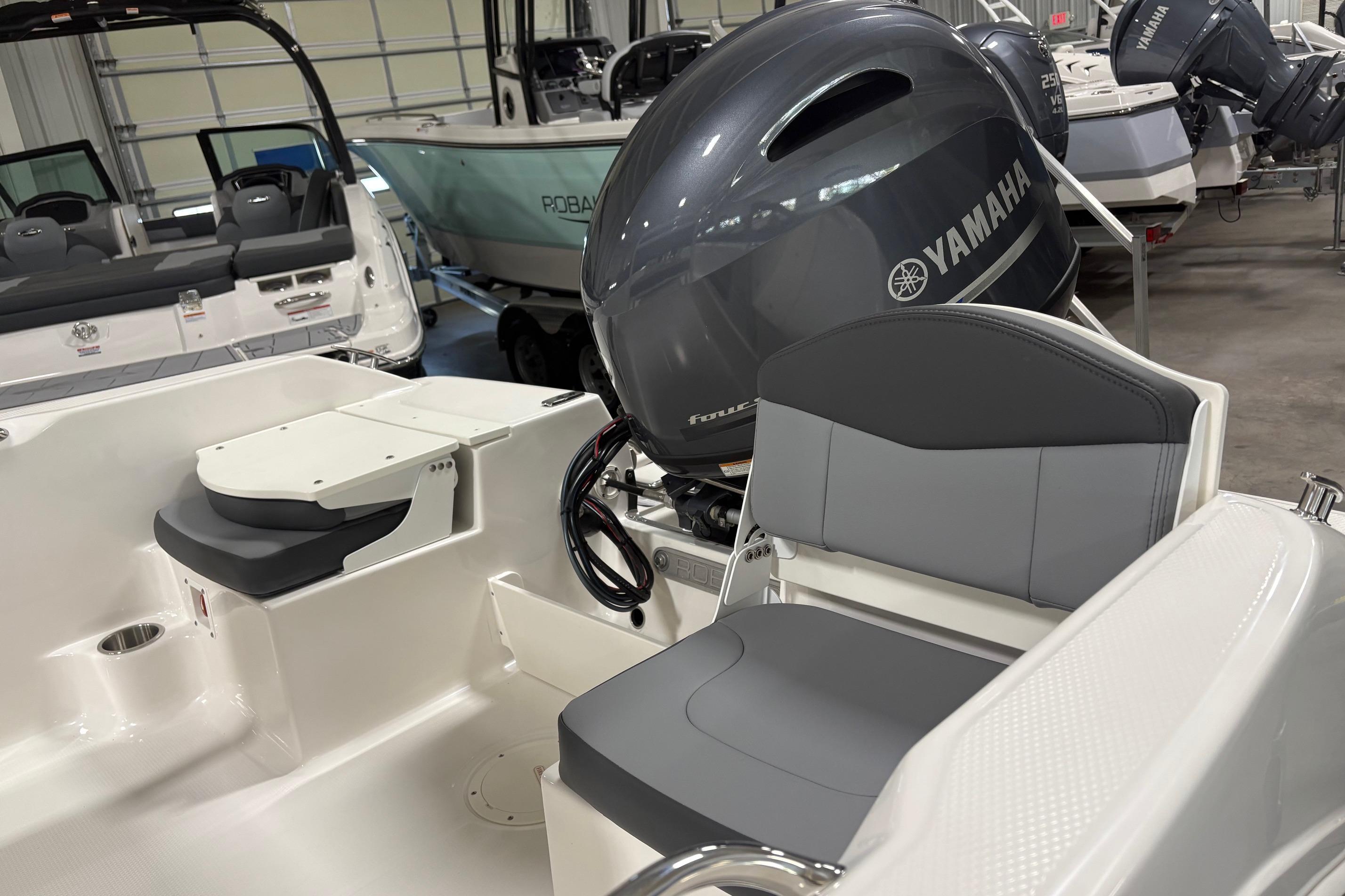 2026 Robalo R160 Center Console boat with Yamaha engine in showroom.