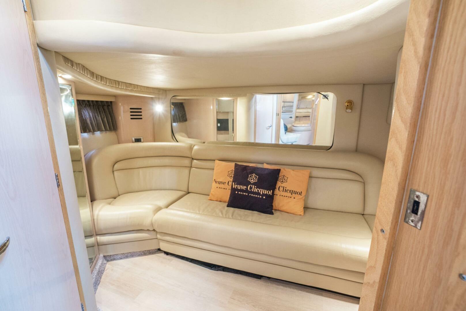 Luxurious interior of 2003 Sea Ray Sundancer 460 yacht with beige leather seating.