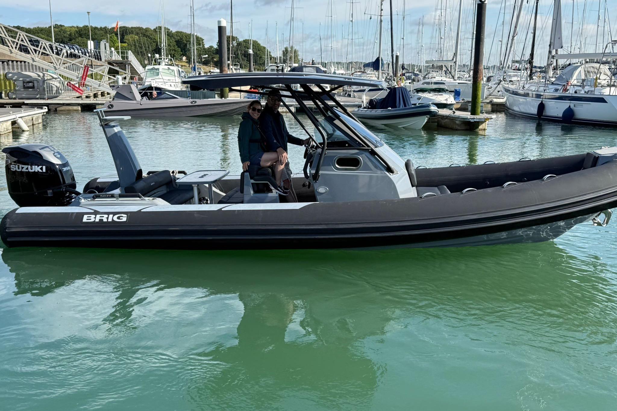 2023 Brig Eagle 8 boat docked in marina with Suzuki engine.