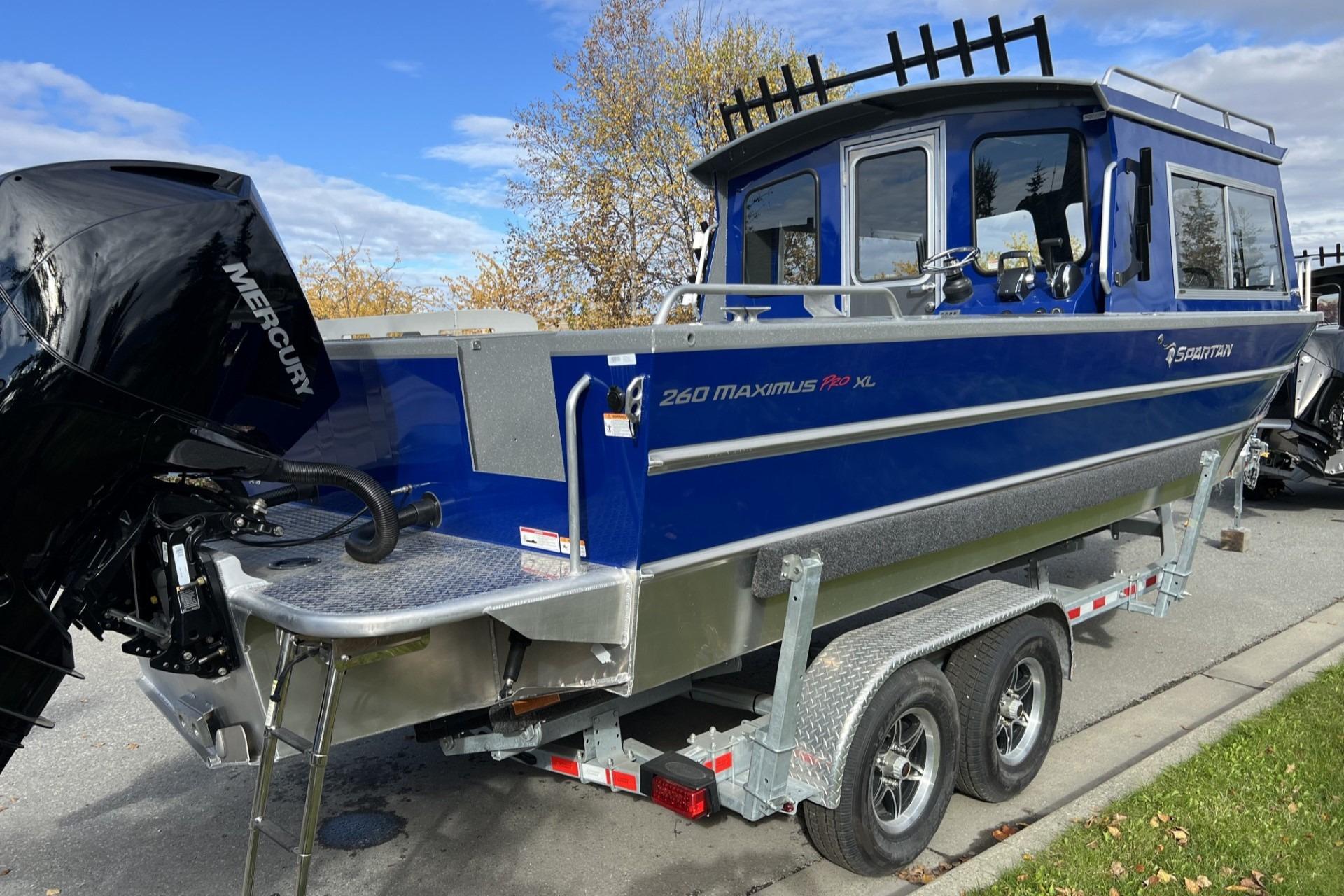 2024 Spartan 26 Maximus Pro XL boat on trailer, featuring a Mercury engine.
