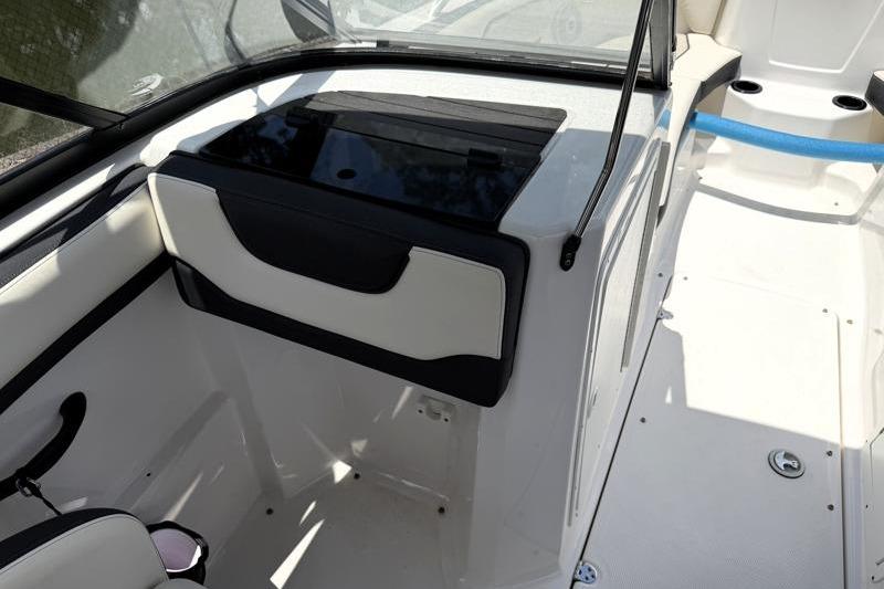 2017 Yamaha Boats SX210 interior with seating and storage compartments.