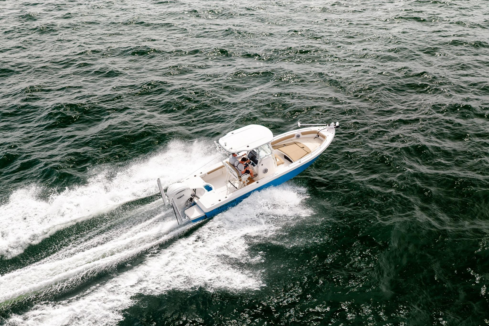 2023 Everglades 243 Center Console boat cruising on open water.