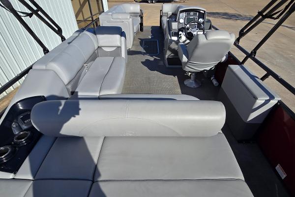 2023 Regency 250 DL3 pontoon boat interior with spacious seating and modern helm.
