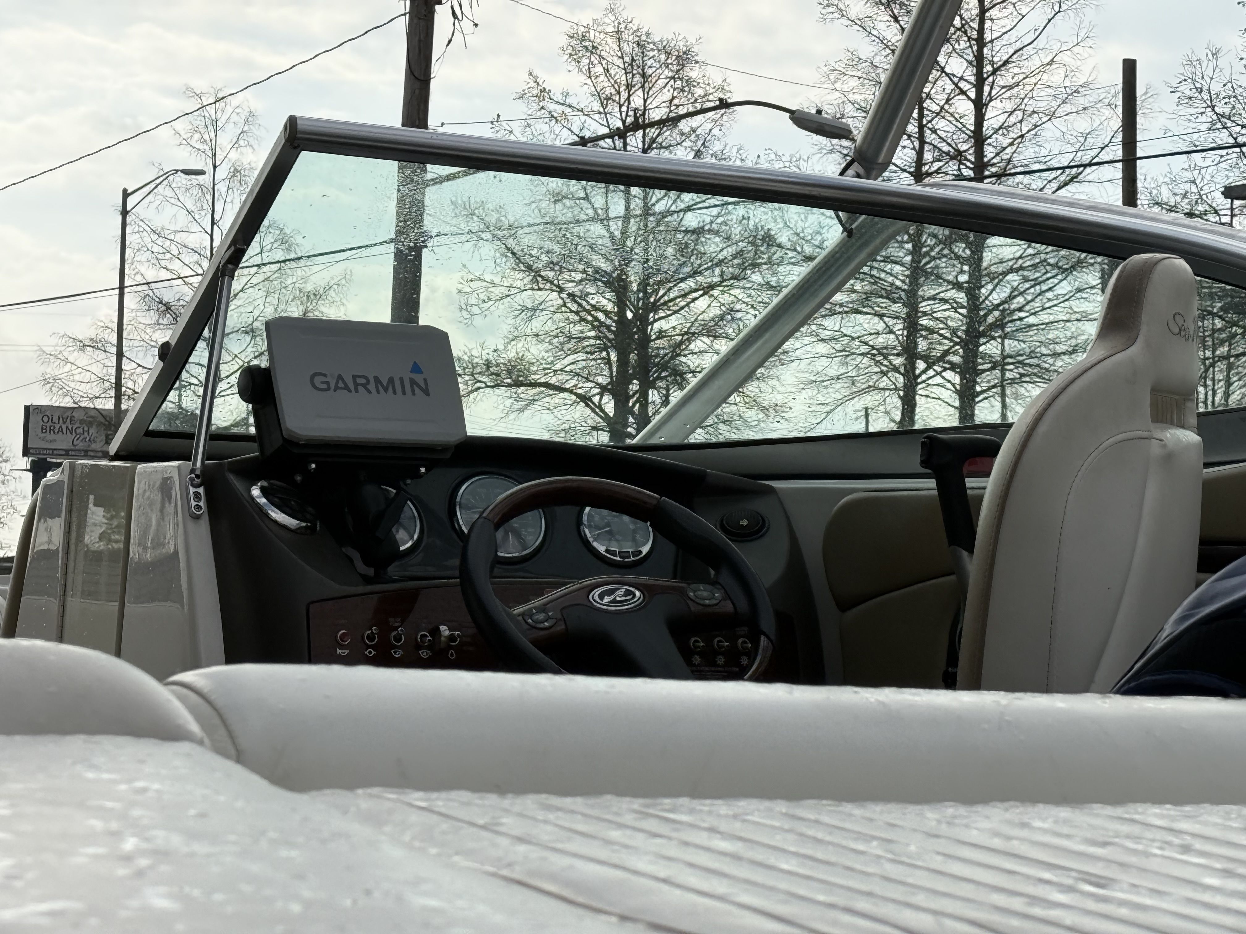 Interior of a 2007 Sea Ray 210 boat with Garmin navigation system.