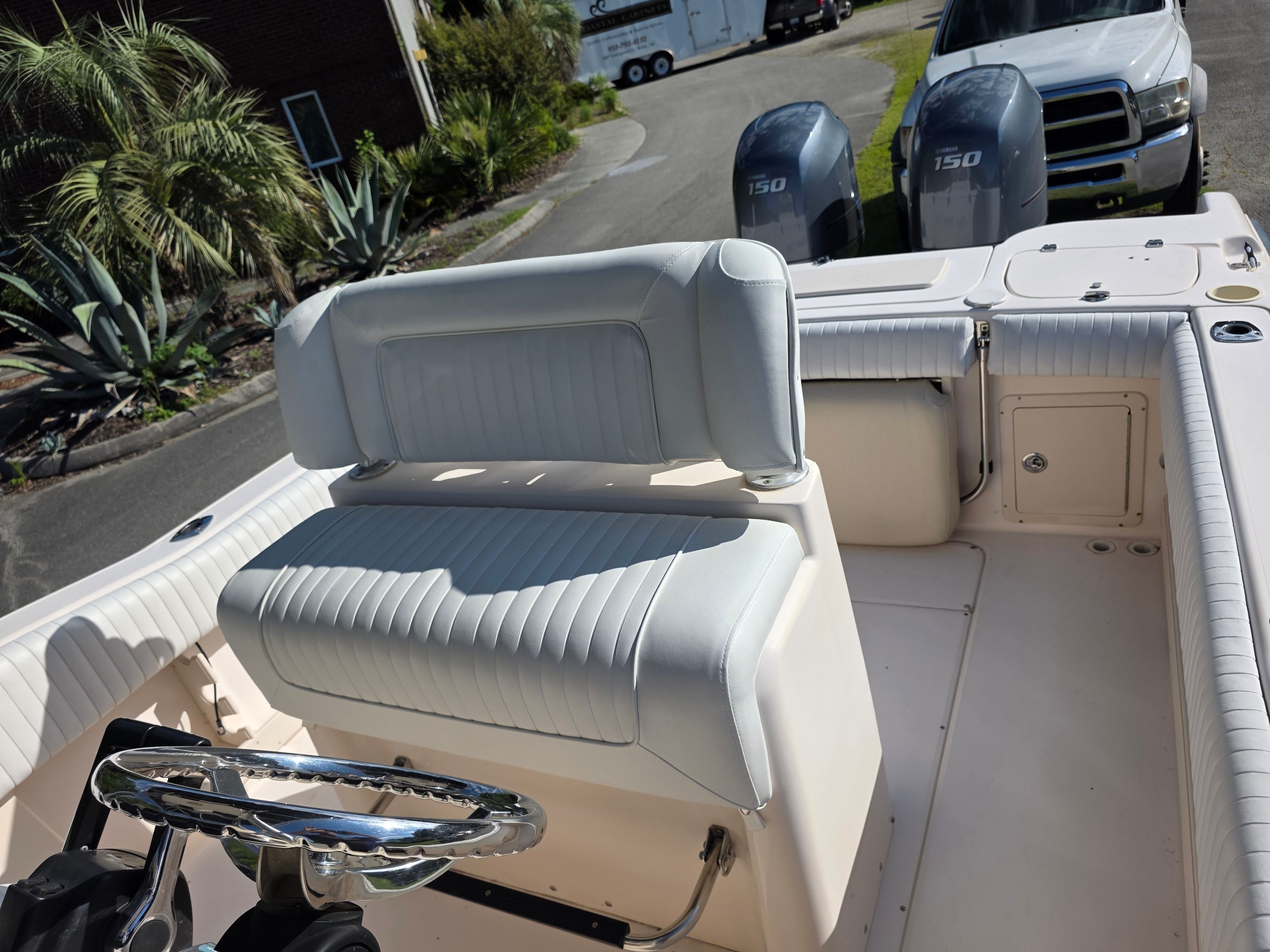 The image shows the cockpit of a 2006 Grady-White 257 boat with two engines.