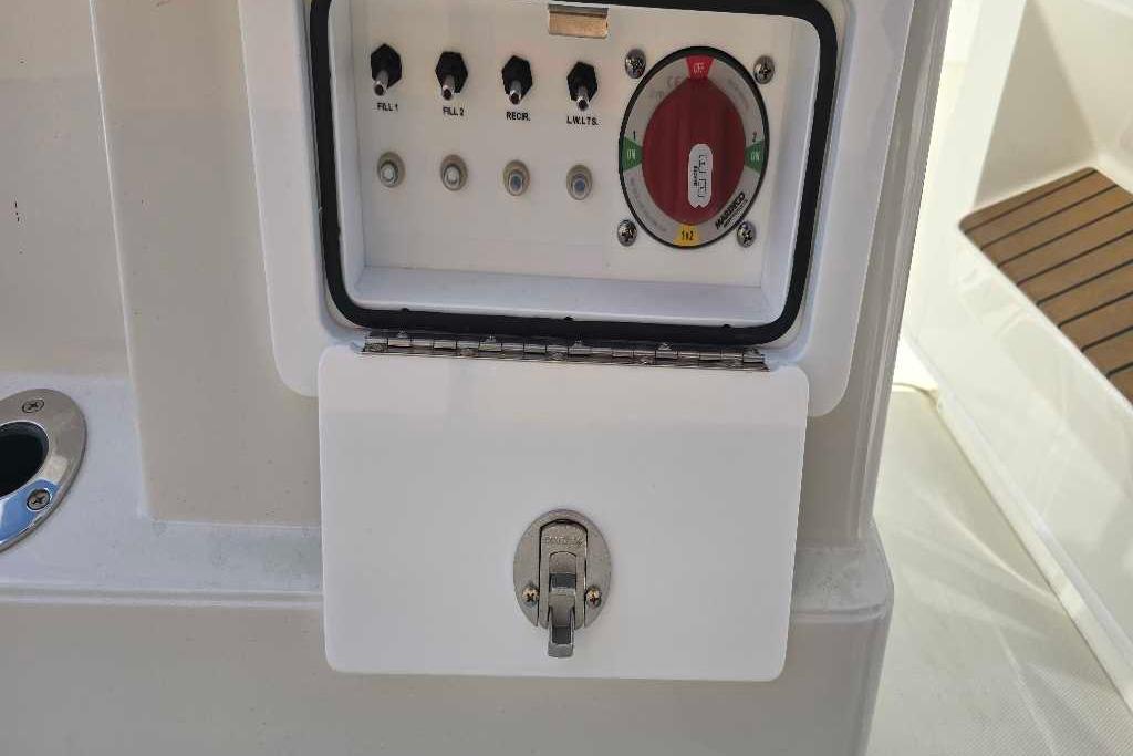 Control panel on 2025 Ranger 2360 Bay boat with switches and dial.