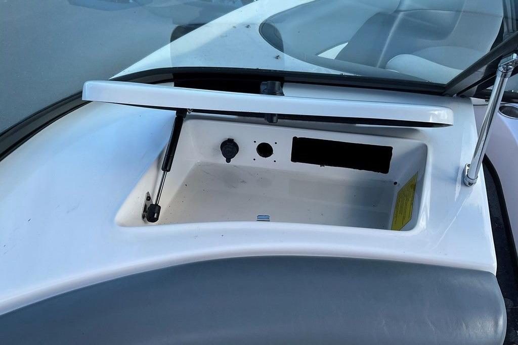 2015 Moomba Outback V boat storage compartment with open lid and hydraulic support.