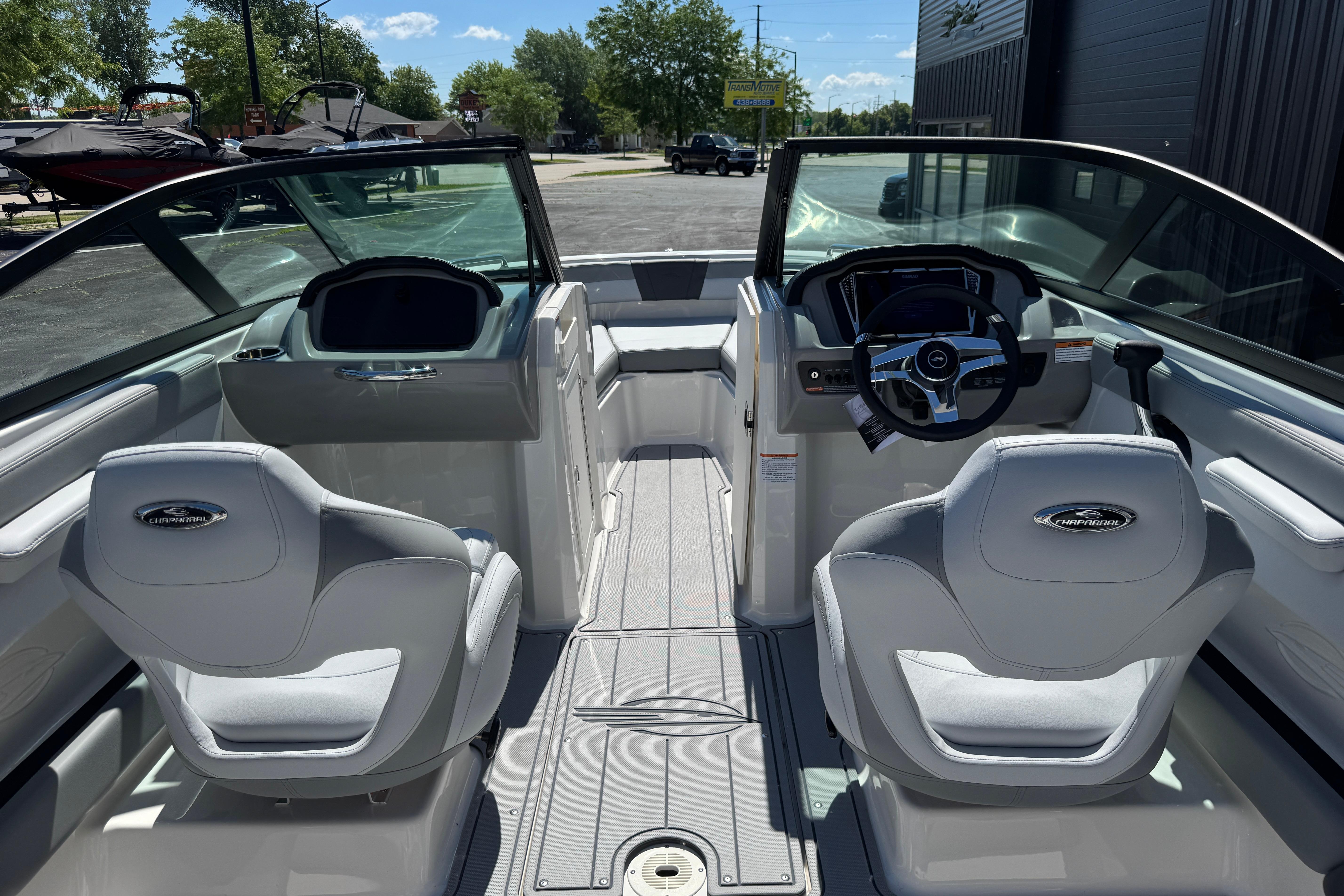 Interior view of 2026 Chaparral 21 SSi boat, featuring sleek design and modern controls.