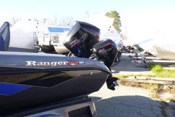 2026 Ranger 621FS Cup Equipped boat with powerful outboard motors in a marina setting.