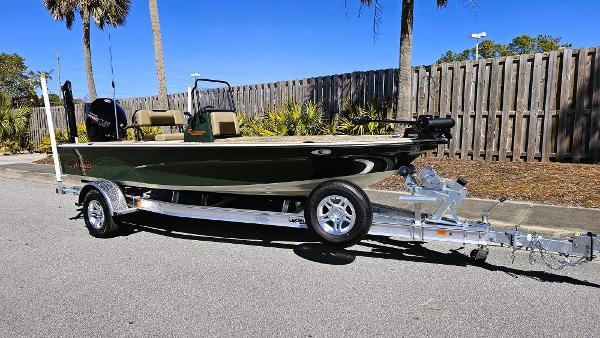 2025 Mako 18 Pro Skiff Backwater Edition on trailer, parked outdoors.