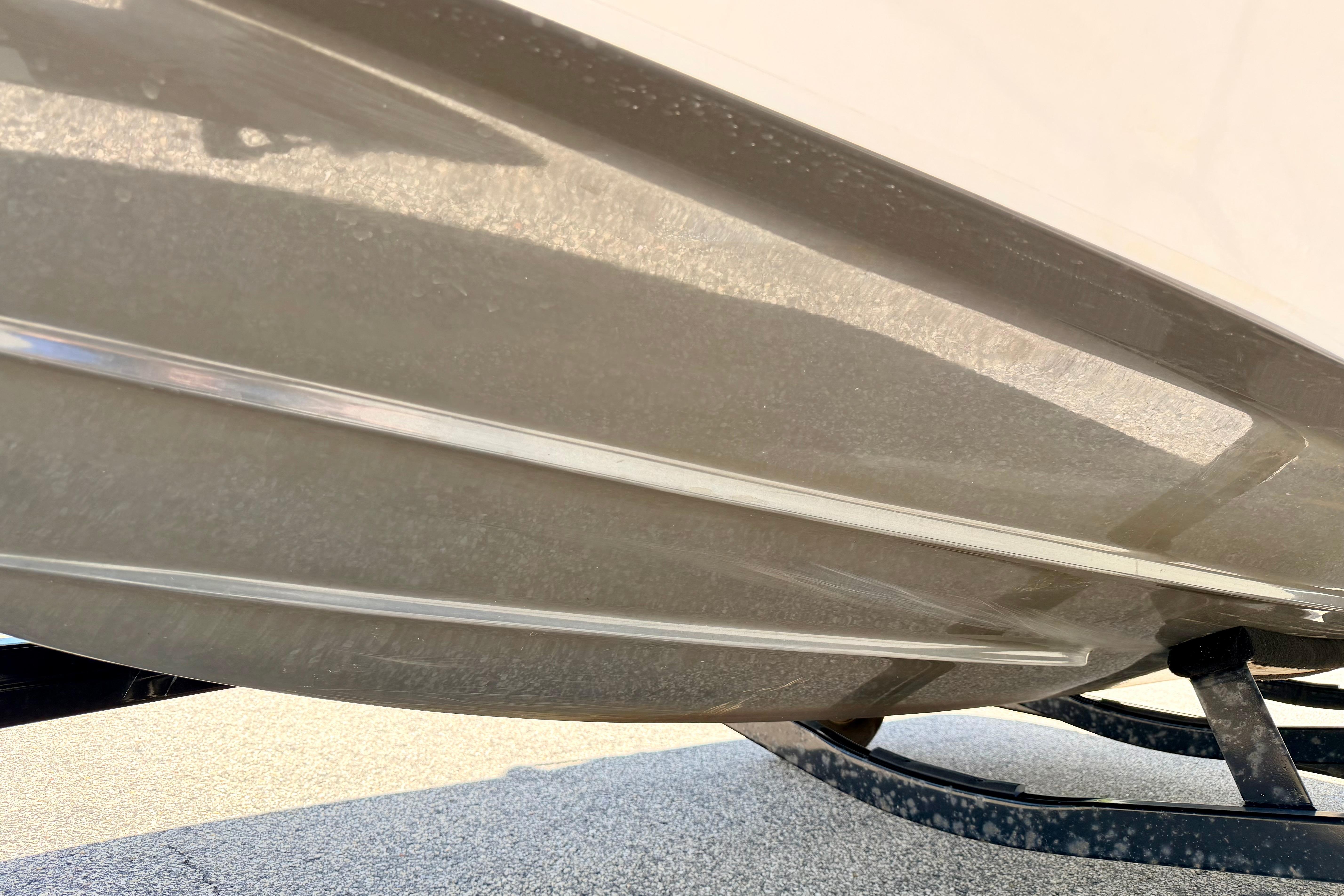 2018 Glastron GT 185 boat hull on trailer, close-up view.