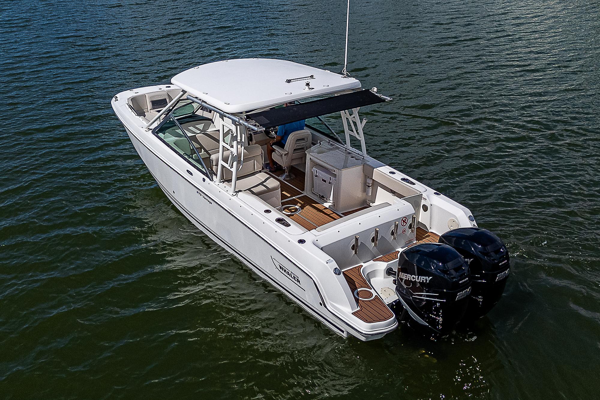 2018 Boston Whaler 270 Vantage boat on water with twin Mercury engines.