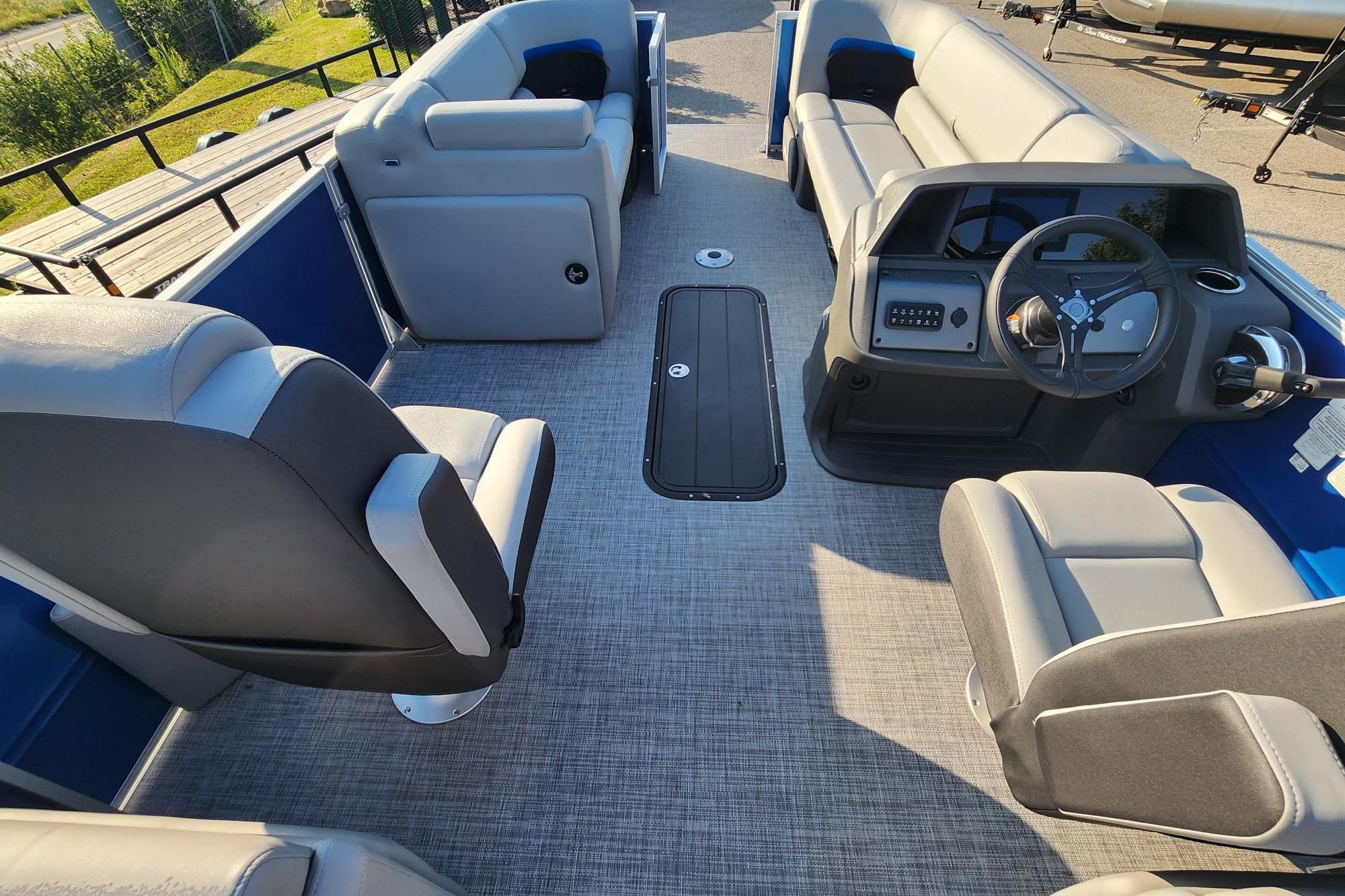 2026 Sun Tracker Party Barge 22 XP3 interior with spacious seating and modern helm.